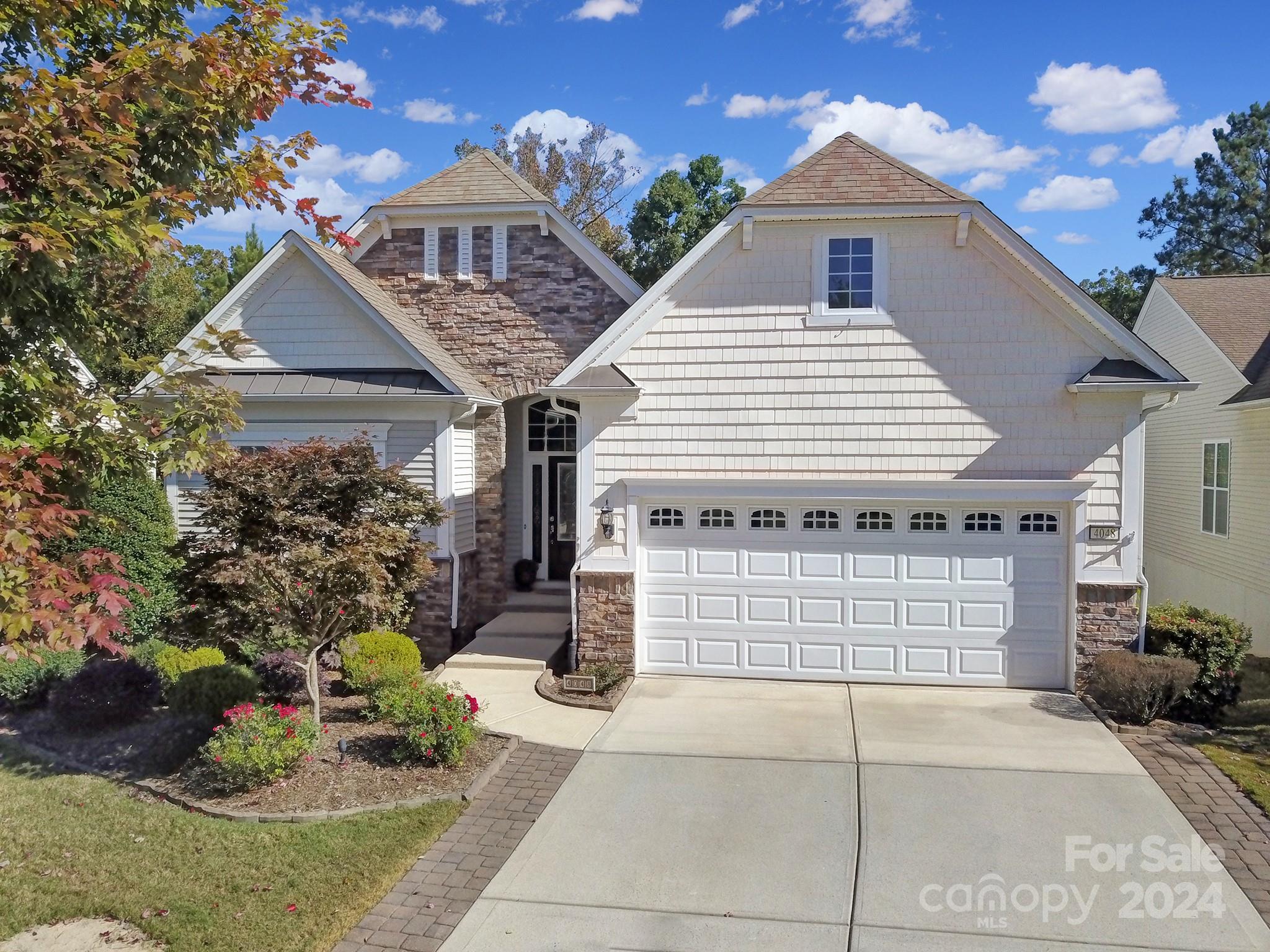 Immaculate Willow Bend bsmt home on private lot w/ wooded view! Tons of natural light, crown molding & wainscoting accents. Cook meals in the eat-in kitchen w/granite counters, SS appliances, gas range, large island & ample cabinetry. The flow of the dining area & great room is perfect for any furniture arrangement! Oversized sunroom leads to the Trex deck w/post lights, power awning & built-in gas line for grilling. Great spot overlooking the woods to enjoy coffee or evening sunsets. Primary suite overlooks the rear yard & has an ensuite bath w/glass shower, soaking tub, dual sinks, & walk-in closet. The office w/double glass doors is ideal for an office or hobby. The spacious walk-out basement has a large bedroom, hall bath, living area w/stone accented gas fireplace & built-ins, kitchenette, game room, fun under-stair play nook, & unfinished area w/utility sink & storage. Doors lead out to the large covered patio. Easily entertain guests & enjoy the privacy of this beautiful home!