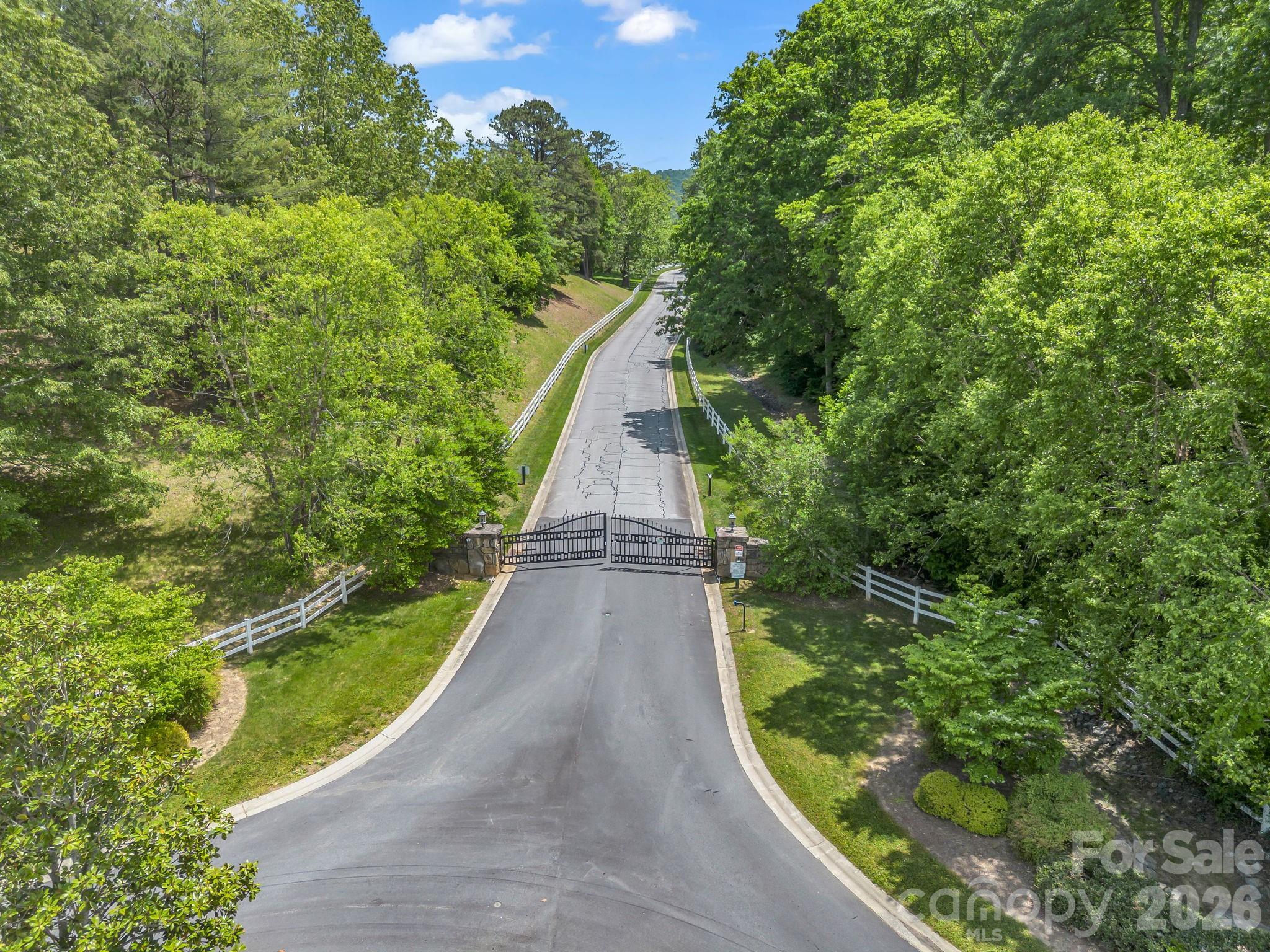 Come build your custom mountain home in the distinguished and upscale, gated community of Waterford Lakes. Nestled in the scenic Cane Creek area, this exceptional 1.19-acre cul-de-sac homesite offers the ultimate blend of privacy, natural beauty, and modern convenience.

Enjoy year-round, long-range pastoral and mountain vistas. Waterford Lakes offers upscale community features including an equestrian center with horse stables and pastures for boarding. Underground utilities are already in place, featuring city water, natural gas, high-speed internet, and cable access. Private septic is required.

While tucked away in a quiet, secure mountain sanctuary, this homesite is incredibly accessible. Located between Asheville and Hendersonville, you are just a short drive to local craft breweries, organic farm stores, grocery markets, excellent schools, and outdoor Blue Ridge adventures. Bring your builder and your floorplans to create a luxury mountain getaway or an expansive estate tailored exactly to your lifestyle!

Disclaimer: A 4 bedroom septic permit was already issued for this property and there is a plan that has been approved by the HOA which buyers are free to use if it suits their needs.