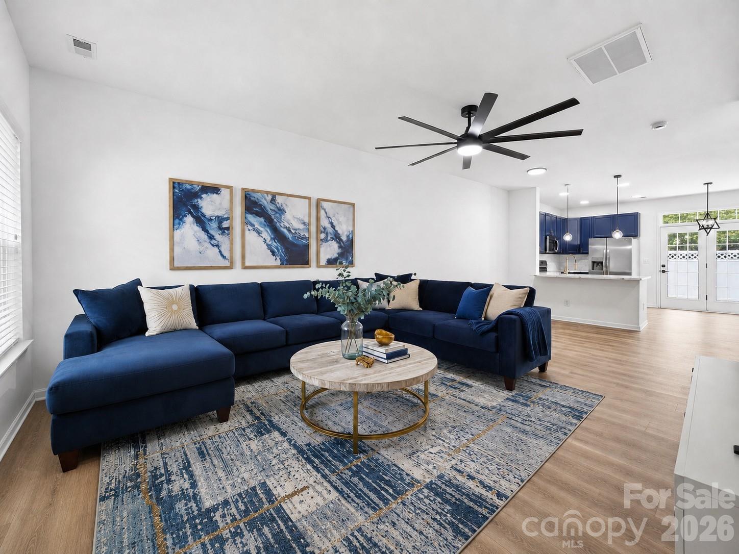 Step inside this beautifully renovated townhome and feel the difference the moment you walk through the door, where every detail was carefully chosen. This home has been transformed from top to bottom, finished with designer-selected touches throughout the home.
The kitchen steals the show with bold blue cabinetry, brushed gold hardware, new quartz countertops, sink, faucet, pendant lighting, backsplash, and brand new stainless steel appliances. The original raised bar was removed and lowered to create a more usable space with added seating and a more open, connected flow between the kitchen and living area.
The entire interior of the home has been freshly painted, with all new light fixtures that bring a bright, modern glow to the home. New LVP flooring runs throughout the main level with new carpet upstairs, while the original wood stairs and railing were sanded and stained to blend seamlessly. The upstairs bathrooms feature new vanities, fixtures, mirrors, and lighting, while the main-level powder room was given the same fresh, modern feel.
Enjoy a private, fully fenced-in backyard with a patio and a peaceful common-area backdrop, plus an attached garage and driveway parking. Picture easy summer afternoons by the community pool, with sidewalks and walking areas just outside your door. Tucked into the Charlotte Pines community in the heart of Steele Creek, you are just minutes from Lake Wylie, Rivergate shopping, Charlotte Premium Outlets, Carowinds, McDowell Nature Preserve, and Charlotte Douglas International Airport.
Homes renovated with this level of care and craftsmanship do not come along often. Come see it for yourself before it is gone.