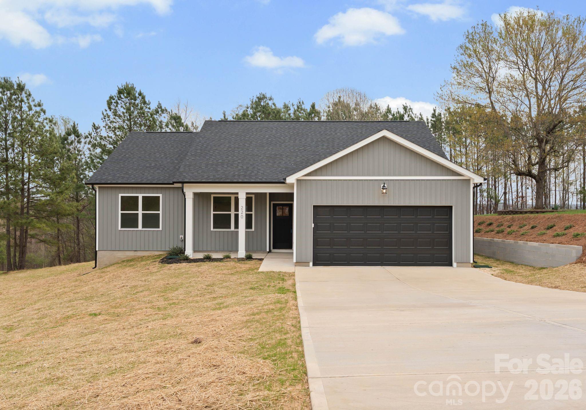 Welcome to this beautifully built 2026 single-story home in the desirable Rucker Downs community of Shelby! Situated on a generous .57-acre lot, this move-in-ready property offers the perfect blend of modern style, comfort, and functionality. Step inside to an inviting open floor plan featuring 1,663 heated square feet, 4 spacious bedrooms, and 2 full baths. The bright living area flows seamlessly into the kitchen, creating an ideal space for entertaining or everyday living. The kitchen comes equipped with stainless appliances including an electric range, dishwasher, microwave, and electric water heater. Stylish finishes such as vinyl plank flooring, tile accents, and walk-in closets add both beauty and practicality. The primary suite is conveniently located on the main level and features a full bath and generous closet space. A dedicated laundry room on the main floor adds convenience to your daily routine. Exterior highlights include an architectural shingle roof, and a covered front porch perfect for relaxing with your morning coffee. The attached two-car garage and driveway provides ample parking and storage. Additional features include central heating and air, county water, septic system, and no HOA. This home offers peaceful surroundings while remaining convenient to local amenities. Don’t miss your opportunity to own this brand-new home in Shelby!
