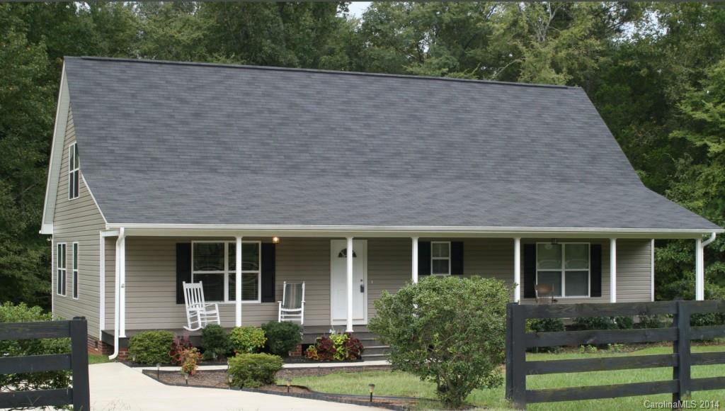 A must-see Cape Cod style home on spacious 2+ acres with wooded privacy in sought-after area of McConnells! Open floor plan, master en suite on main with second master en suite upstairs,  third bedroom on main, 3 full baths, large bonus room that could serve as playroom, recreation room, office, or many other options, and plenty of storage! Second AC unit for upper level. Inviting front porch, spacious back yard with expansive wood deck. Optional above-ground pool and swing set.