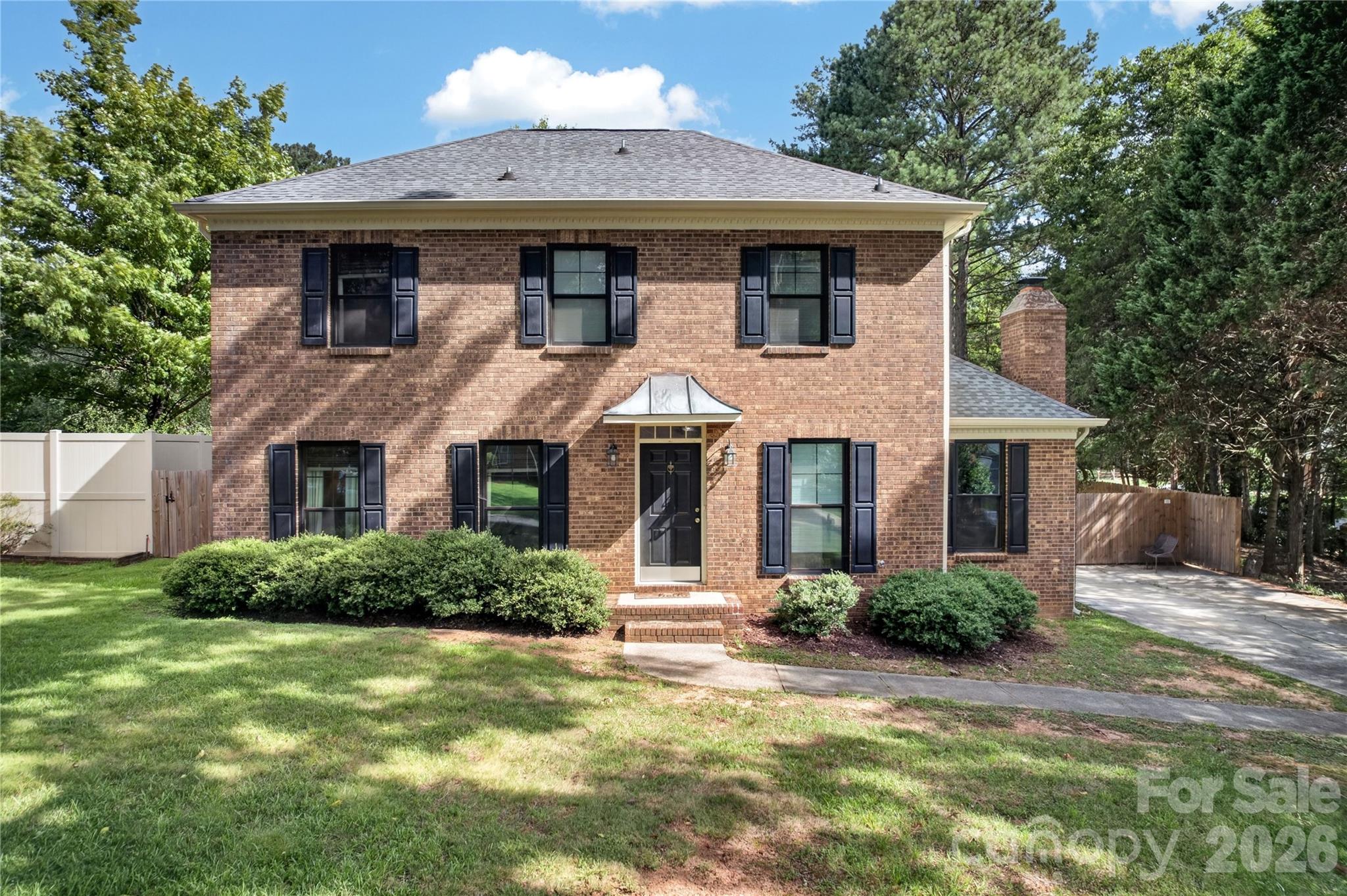 Welcome to this charming brick-front home in the highly desirable Sardis Forest neighborhood. A bright, welcoming foyer with convenient access to the powder room sets the tone, featuring luxury vinyl plank flooring that extends throughout the entire home.

The spacious formal living room is filled with natural light and flows seamlessly into the dining room, currently styled as a versatile entertaining space. The beautifully renovated kitchen boasts timeless white shaker cabinetry, quartz countertops, a classic tile backsplash, and stainless steel appliances. Just off the kitchen, the cozy breakfast nook features built-in bench seating and overlooks the flat, partially fenced backyard, perfect for enjoying your morning coffee or casual meals.

Adjacent to the breakfast area, the inviting great room offers a warm and comfortable gathering space centered around a charming brick fireplace. The perfect spot to relax or entertain. 

Upstairs, the spacious primary suite includes a beautifully renovated ensuite bathroom and custom closet shelving systems for enhanced organization. Two additional bedrooms and an updated hall bathroom complete the thoughtfully designed second floor, offering the perfect blend of classic character and modern updates.