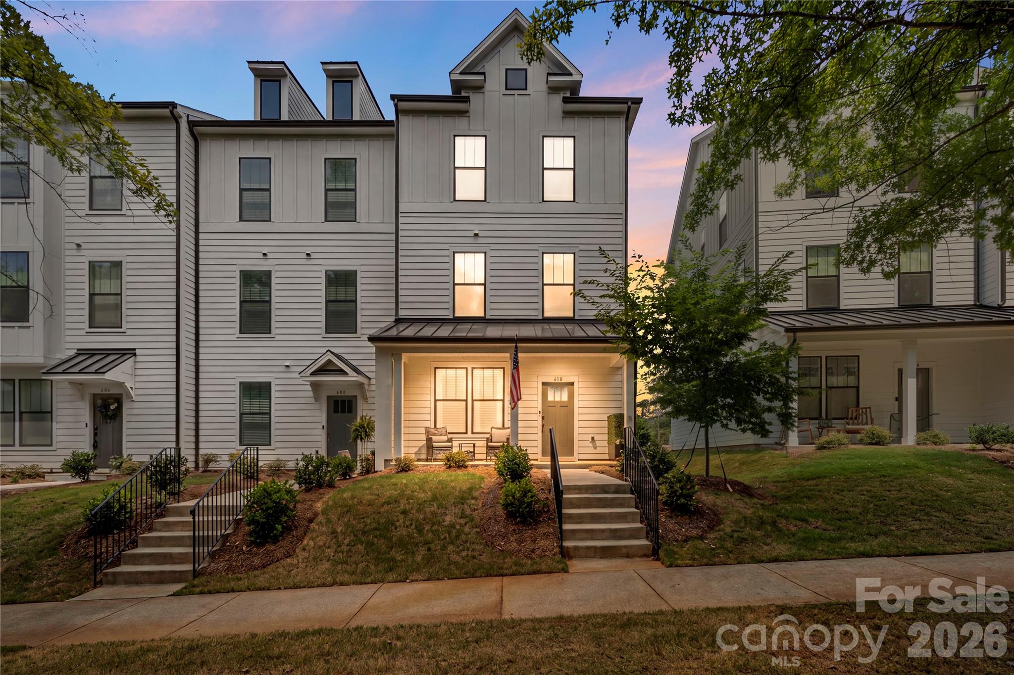 Like-new construction without the wait of new construction! This 3-story townhouse built in 2024 offering 4 bedrooms and 3.5 bathrooms in the highly desirable Baxter Village neighborhood is ready for its next owner! The versatile floor plan features a private lower-level bedroom plus a full bath, perfect for guests, a home office, or multi-generational living. The second level showcases an open-concept design with luxury vinyl plank flooring, a spacious living room, dining area, and a modern kitchen complete with a large island with breakfast bar, pantry, modern fixtures, SS appliances and ample cabinetry and counter space. Moving to the Upper level the primary ensuite includes a walk-in closet,  private bath with dual vanities and tile surround shower. The upper level is completed with two additional bedrooms; both providing additional living or flex space, and convenient upper-level laundry. Enjoy outdoor living on the private deck off the second level and the convenience of an attached 2-car garage. Community amenities include an outdoor pool, tennis courts, playground, and walking trails. With modern finishes, fiber optic internet availability, and a prime location near shopping, dining, and tons of entertainment this home offers both comfort and convenience. Easy access to I77 and 485 Inner and Outer loops