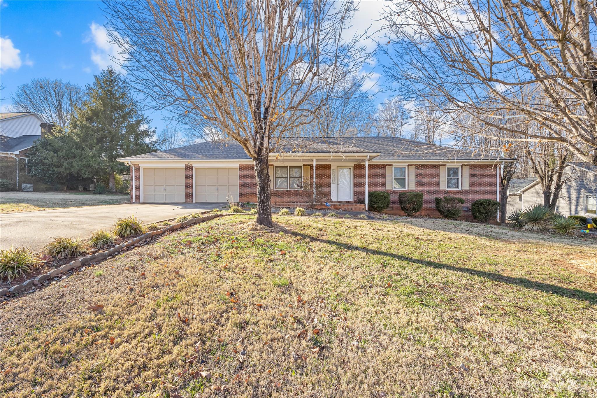 Welcome home to this lovely one story brick ranch on nearly half an acre. This home is nestled in sought after Deerfield Neighborhood. The home features tons of storage space, over sized garage, beautiful brick fireplace, and screened in back porch for those warm Carolina summer nights. It's a blank slate and is patiently awaiting you to add your personal touch.