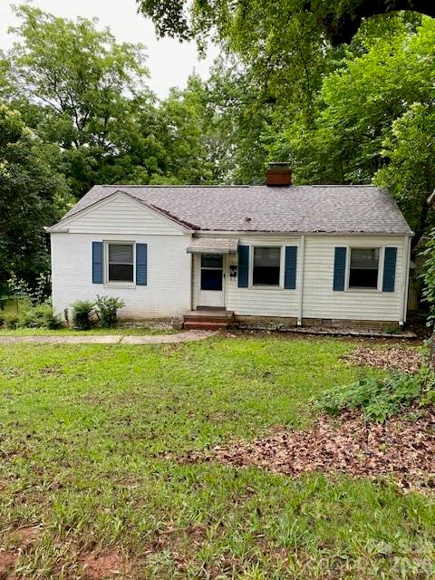 Cute Bungalow in Historic Camp Greene Association area - well maintained, small garage opening on left side of home, refrigerator/stove included, Hardwoods through living room, bedrooms.  Nice view or supersized .54 acre back yard.  This home would be easy to add onto for more living space or outdoor living space.  The kitchen is bright and has updated cabinetry, and stove and refrigerator are newer.  Home has the awanings over windows, and home is well maintained.  Ready for move-in for tenant or homeowner.  Great price in a location that is evolving to the newest uptown area being transformed - in Historic Camp Greene.  Go to FB - Historic Camp Greene Association - a non profit that has social events, street cleanups, - meeting bi-monthly on the 3rd Tuesday of each month.  Organized Non-Profit who has funding from the City of Charlotte.  This area is popular and a converstion to this home would bring high price with a good profit margin.  LARGE LOT is impressive.  Very active community of owners.