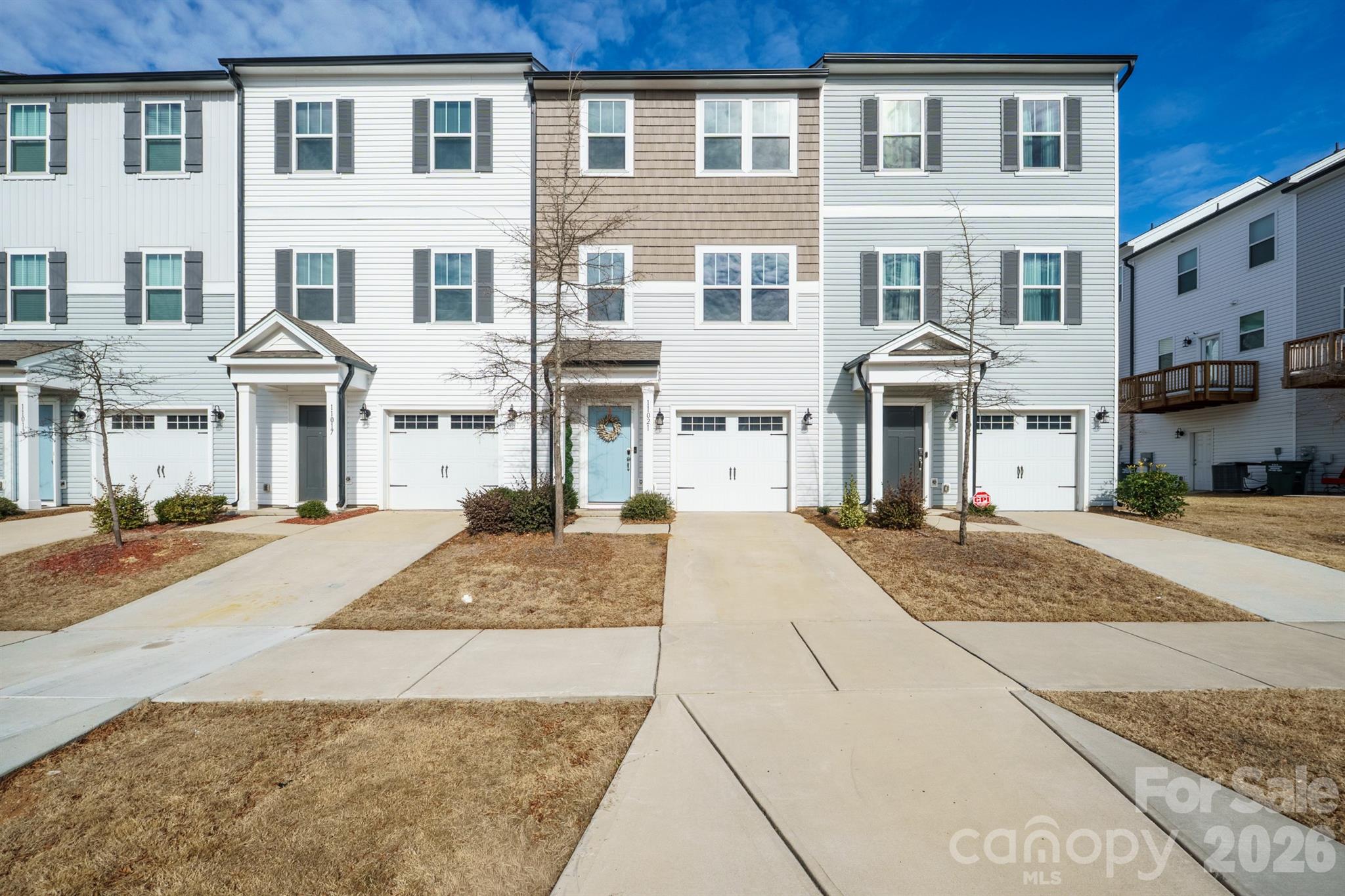 Welcome to this beautifully maintained, like-new construction townhome in the desirable Woodland Creek community, offering a perfect blend of modern style, comfort, and convenience. The open-concept main level is filled with natural light and features a bright, chef-inspired kitchen with crisp white cabinetry, stainless steel appliances, ample counter space, and a large island, ideal for casual dining and entertaining. The kitchen flows seamlessly into the spacious living and dining areas, creating an inviting space for everyday living and gatherings.
Upstairs, the generously sized primary suite provides a relaxing retreat with a private bath and ample closet space. Secondary bedrooms are perfect for guests, a home office, or a growing household. Additional highlights include a convenient laundry area, Puronics water filtration system, electric vehicle charger, and thoughtful finishes throughout. Step outside to enjoy the private deck.
Ideally located just minutes from UNC Charlotte, shopping, dining, and major highways, this home offers easy access to everything the University area has to offer. A move-in-ready opportunity in a thriving community!