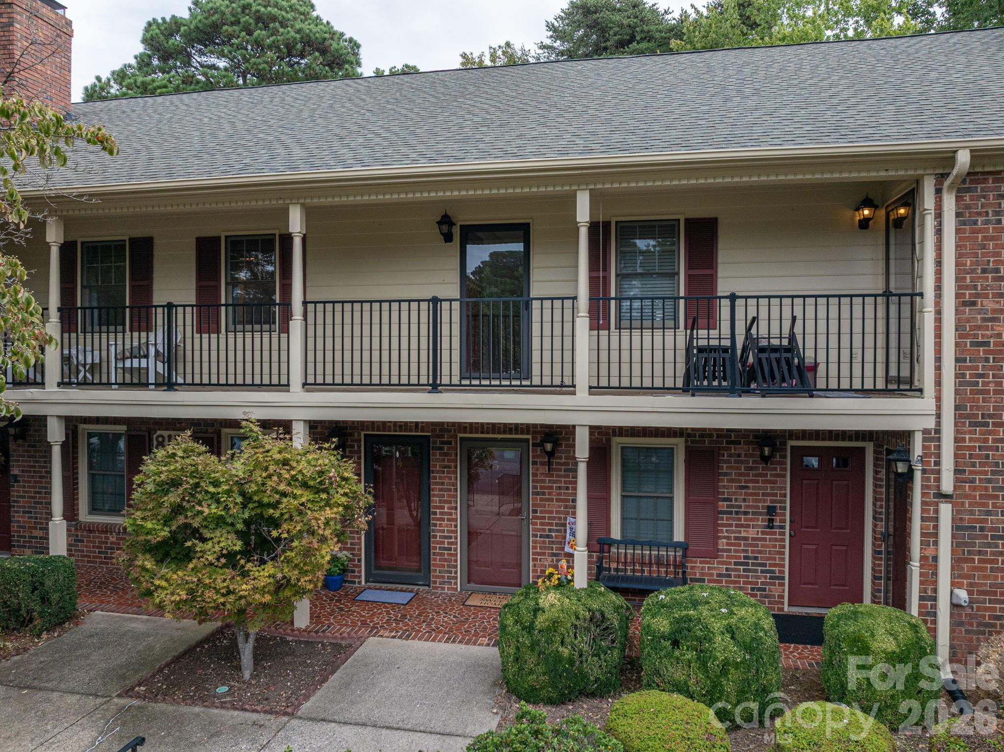 Enjoy the privacy and security in this spacious Jamestown Condominium.  Private main-level entry foyer that sets the tone for this warm and inviting home. Relax in the spacious living room featuring a cozy masonry fireplace—perfect for those early spring evenings. You'll appreciate the fresh new carpeting in the living room and both bedrooms. The dining area and kitchen offers easy-care laminate wood flooring, combining style and durability.  Ample cabinet storage. Step out onto the 10’ x 12’ private deck just off the dining room, where you can enjoy peaceful views of the wooded backyard—a rare find in condo living! This sought-after community offers fantastic amenities, including a beautiful in-ground swimming pool. The Homeowners Association covers exterior maintenance, so you can enjoy a low-maintenance lifestyle. Conveniently located near shopping, dining, fitness centers, Martha Rivers Park, and more, this location truly offers the best of Gastonia living. Don’t miss your chance to own in one of Gastonia’s most desirable condominium complexes!
