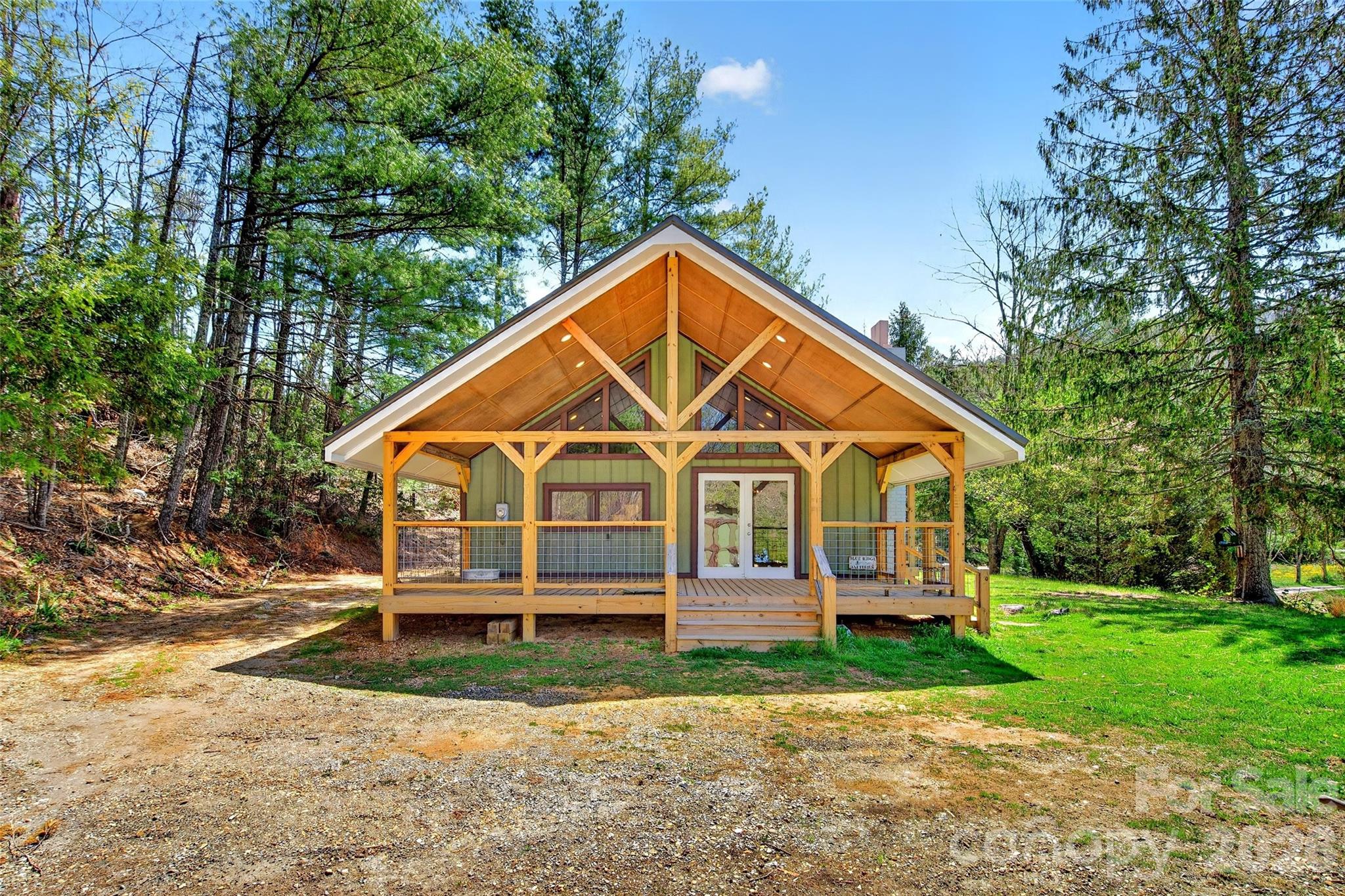 Welcome to your private mountain retreat just off the Blue Ridge Parkway near the Orchard at Altapass in beautiful Spruce Pine, NC. Situated on approximately 2.412 acres with a peaceful creek and open usable land, this beautifully updated mountain home offers the perfect blend of privacy, charm, and convenience.

This mountain retreat features a warm and inviting interior with 1 bedroom, 1.5 baths, and a versatile loft ideal for additional sleeping space, office, or hobbies. A cozy wood-burning stove anchors the living area, creating the perfect mountain ambiance year-round. Step outside onto the exceptional covered porch overlooking the creek and open land — an ideal setting for morning coffee, relaxing evenings, or simply taking in the peaceful surroundings.
With its prime mountain location, natural beauty, and easy access to the Blue Ridge Parkway, hiking, and local attractions, this property offers the ideal full-time residence or mountain getaway. 

The adjoining cabin property with 3.17 Acres and two ponds is also available for $250,000,- MLS#4380608 - giving buyers the rare opportunity to purchase both properties together for $549,000 MLS# 4372351 for an expanded mountain retreat, family compound, or investment opportunity. These properties will share the spring water and deeded access. See adjoining property MLS #4380420