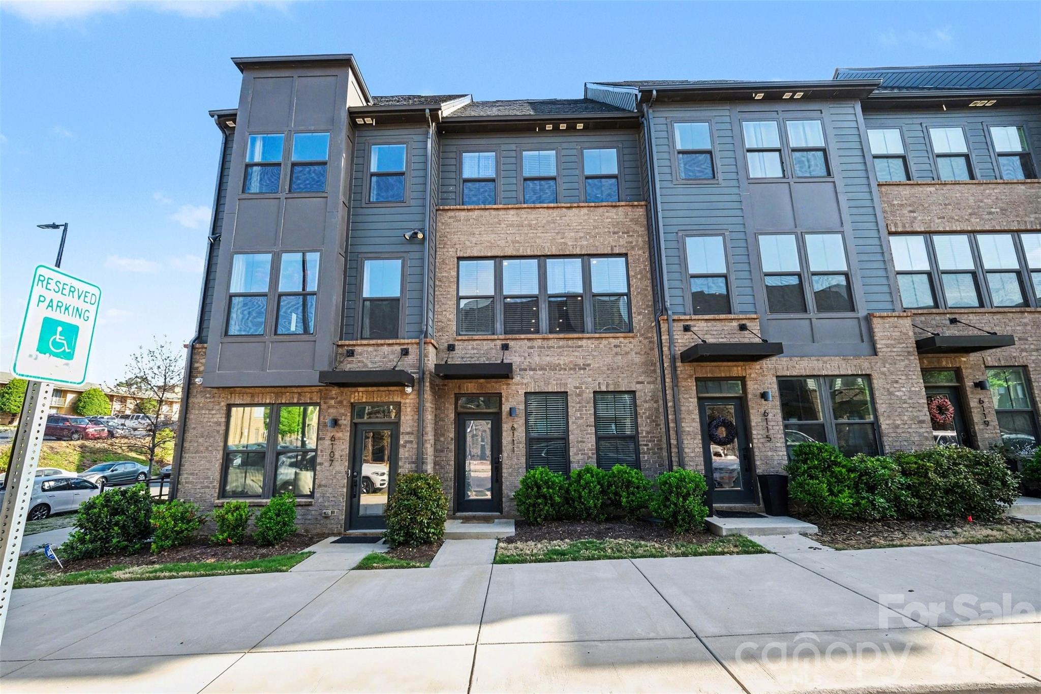 Discover the perfect blend of modern luxury and vibrant city culture in this meticulously designed townhouse, conveniently located in the heart of Charlotte's popular LoSo (Lower Southend). This stunning, multi-level home boasts an open-concept main floor, designed for entertaining and filled with natural light, featuring high-end finishes, premium appliances, and a seamless flow between the living room, dining area, and kitchen. The spacious owner’s suite offers a serene retreat with a custom walk-in closet and a spa-inspired ensuite bathroom. The true highlight? Your own private rooftop terrace—ideal for that morning coffee or evening city views. You are within walking distance to the Woodlawn Light Rail station, providing easy access to Charlotte’s premier arts district, including local breweries, coffee shops, galleries, and Uptown Charlotte to root on the Panthers, Hornets, Knights and Charlotte FC! How about some extras? The private garage has custom built in shelving and is equipped with a Tesla EV charger and the home is wired for AT&T Fiber. Looking for a deal? This home is eligible for 100% financing PLUS a $1,500 lender credit with preferred lender.