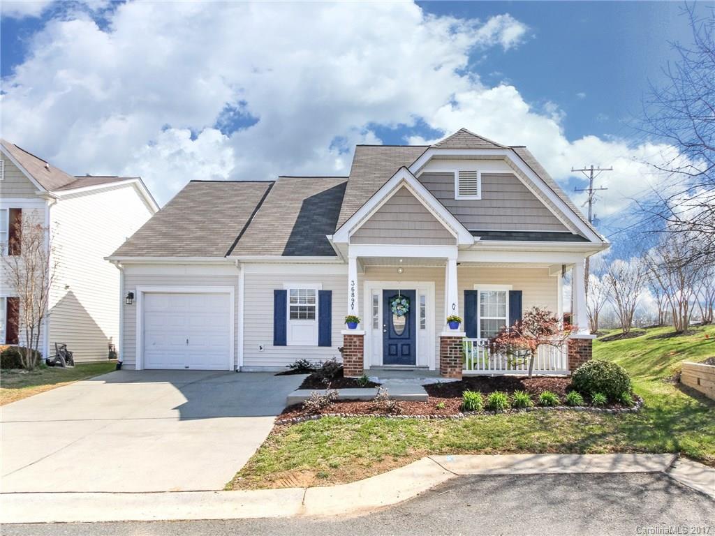 Make this CHARMING 3 bedroom house in the Arlington subdivision your home!  This lovingly maintained home, has the master on the main level, an adorable fenced backyard with a covered patio for outdoor living, and an upstairs loft area perfect for an office or media room. The community has a clubhouse, pool and exercise room.  Conveniently located minutes from dining and shopping in Ballantyne, Indian Land, or Fort Mill!