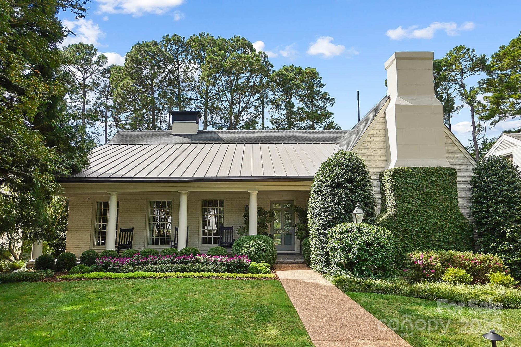 Welcome to this timeless Myers Park residence, an elegant 4,200 sq ft home that feels straight out of the pages of Southern Living. Perfectly positioned overlooking the golf course, it blends classic Southern charm with refined modern living. Step inside to a warm, inviting layout designed for both everyday comfort and unforgettable entertaining. The heart of the home is the kitchen with a lovely keeping room, cozy fireplace, and breakfast room, while the formal dining and living areas set the stage for gracious dinner parties and holiday gatherings. An inviting screened porch with Cumaru hardwood floors on the second level offers year-round enjoyment and sweeping golf course views. Upstairs, an entire level is devoted to the ultimate primary retreat. Wake up to a sun-filled sitting room with a wall of windows overlooking the greens, enjoy a morning coffee from your private beverage center, and luxuriate in two expansive walk-in closets. The walkout ground level offers a versatile family room, en suite bedroom ideal for guests or multigenerational living, and seamless access to a spacious backyard featuring an open patio and covered patio designed for memorable gatherings, along with more stunning golf course views. Every detail of this home has been crafted for elegance, comfort, and an unparalleled Myers Park lifestyle.