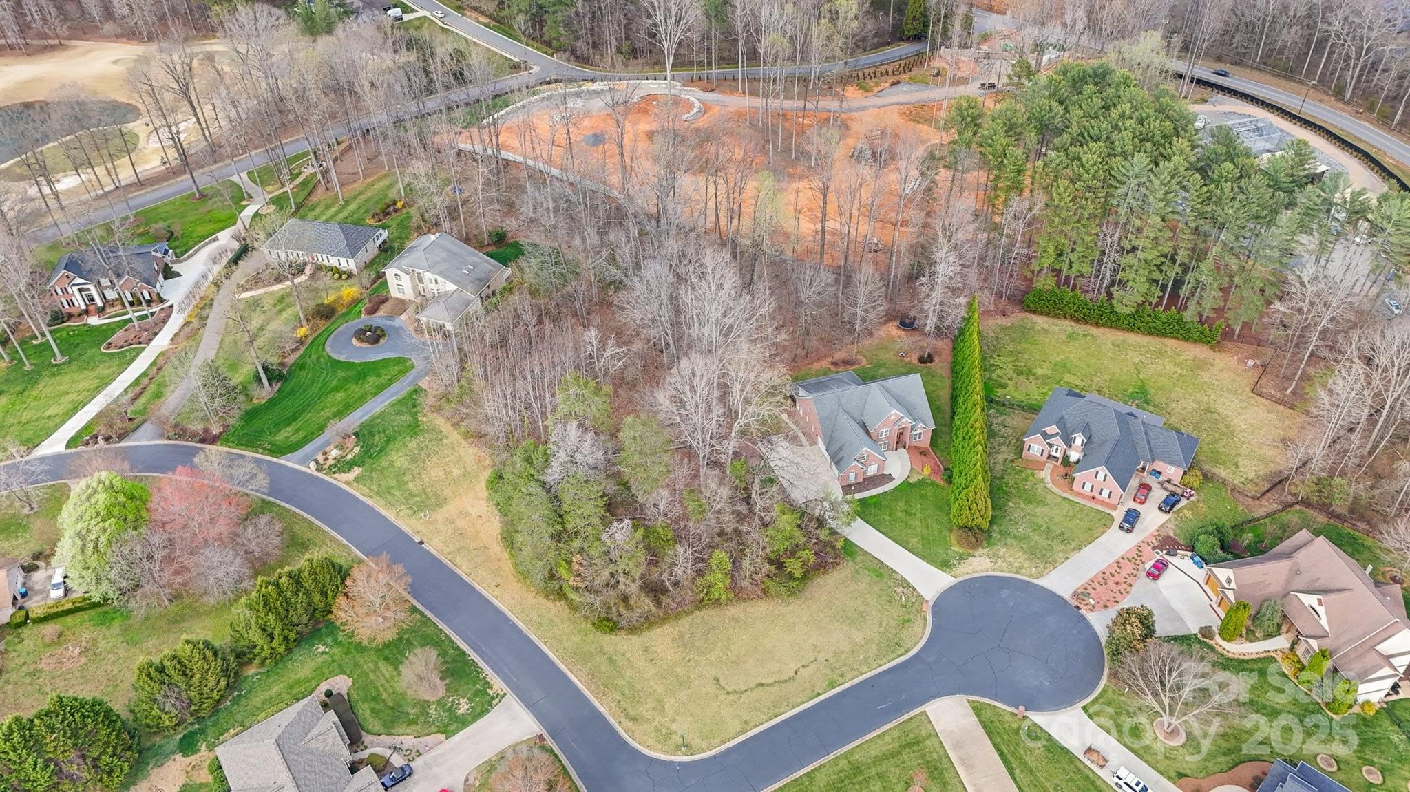 Prime Corner Lot in Prestigious Rock Barn Country Club & Spa! Build your dream home on this partially cleared, level, corner lot spanning over half an acre. Enjoy luxurious amenities with an optional Rock Barn membership offering world-class amenities including two championship golf courses, a high-end spa, tennis and pickleball courts, a state-of-the-art fitness center, an Olympic-sized pool, and more! Have convenience by being located within easy access to I-40, Hwy 16 and Hwy 70. There is also a rare opportunity to purchase the adjacent lot! Perfect scenario to add additional space & privacy to your future homesite! See MLS #4316612
