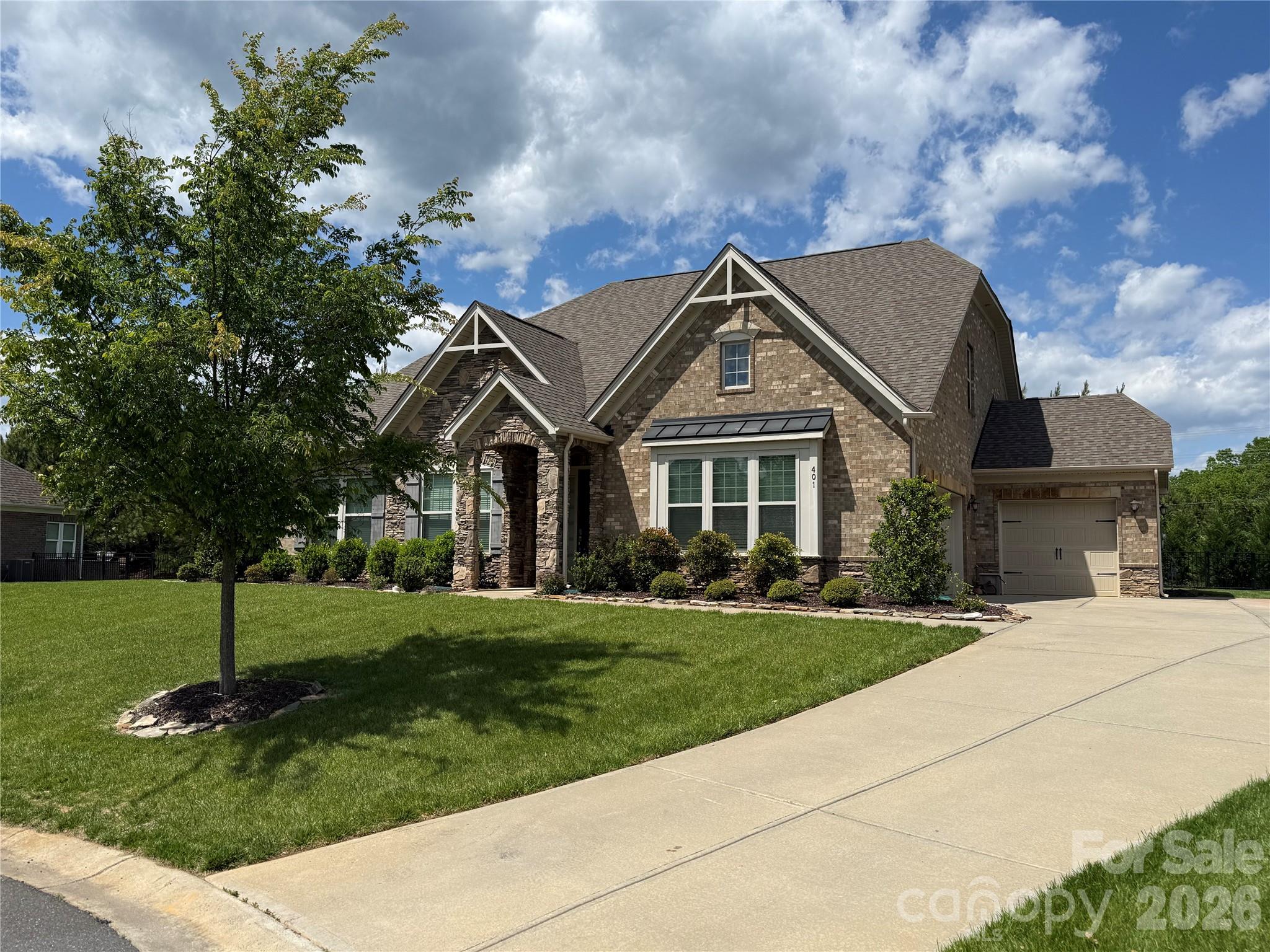 Beautiful brick home in the highly sought-after Weddington school district—priced to sell and offering exceptional value! This spacious and versatile floor plan features 5 bedrooms (or 4 plus a bonus) and 3 full baths, along with a rare 3-car garage with extended driveway that allows for ample parking space.

The open-concept design showcases a stunning family room with a coffered ceiling and a striking stone fireplace with gas logs, flowing seamlessly into the gourmet kitchen. The kitchen is a true centerpiece with a large island and bar seating, stainless steel appliances, wall oven, convection microwave, granite countertops, tile backsplash, and a walk-in pantry—all opening to a bright breakfast area filled with natural light.

The main level offers 3 bedrooms, while the upper level features 2 oversized bedrooms, plus walk-in attic access and abundant storage throughout. Enjoy outdoor living on the screened porch overlooking a fenced backyard or underneath the pergola on the beautiful stone patio—perfect for relaxing or entertaining.

Ideally situated on a quiet cul-de-sac just minutes from shopping, dining, and amenities in Wesley Chapel and Waverly. Home is priced with opportunity in mind—ready for a buyer to add their personal touch with fresh paint and make it their own!