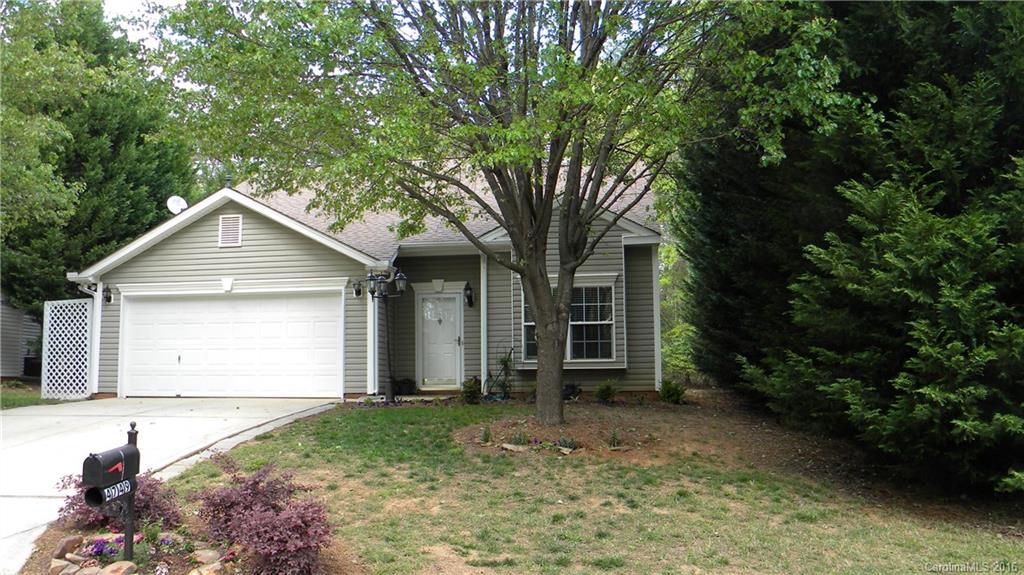 Lovely home nestled in the trees.  Master is on the main with 2 bedroom and a loft upstairs.  The dining and greatroom have wonderful view of the fireplace with gas logs.  The kitchen has its own breakfast area with a breakfast table and bench that will be left with the home.  The outdoors has a nice patio with an elevated deck overlooking a lovely yard.   There is also a hot tub that will be left with the home and is being left "as is".  It is in working condition.