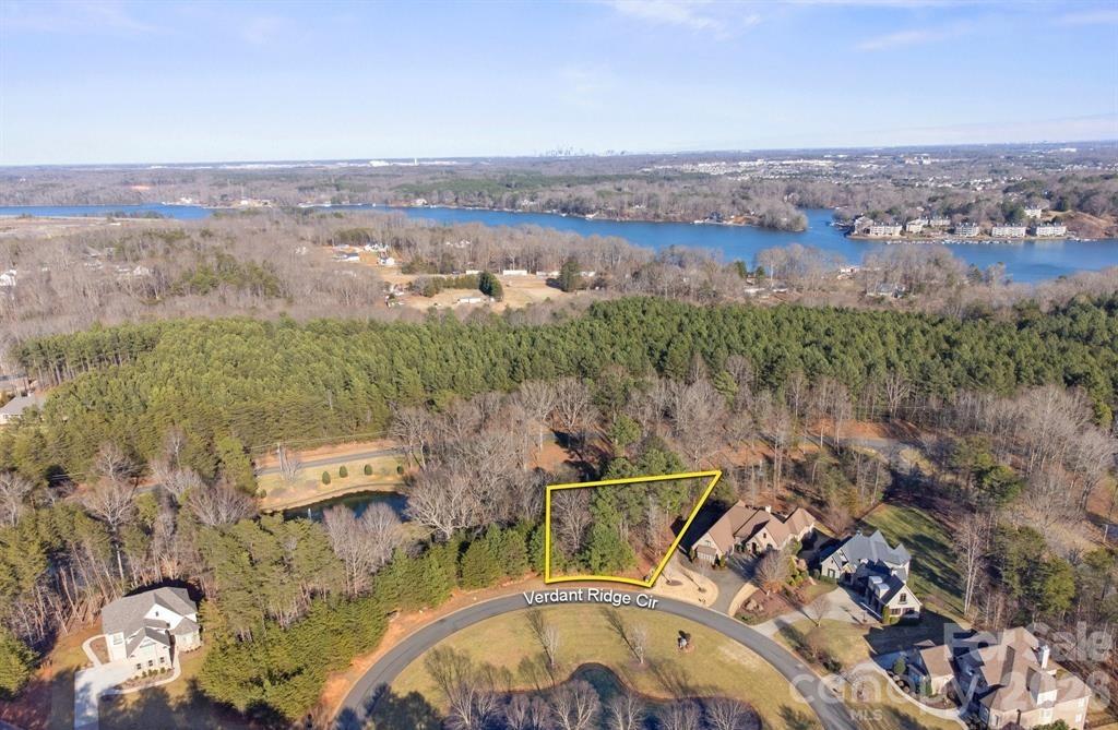 A rare canvas for your dream home, this prime 0.82-acre pond-view lot is nestled in Reflection Pointe, one of the most prestigious gated waterfront communities on Lake Wylie. With serene pond views both front and back, this homesite offers privacy and beauty.
Residents enjoy French Provincial inspired clubhouse amenities, a picturesque fountain, beautifully maintained parks, walking trails, tennis courts, swimming pool, boat storage, and Lake access, perfect for those who love an active waterfront way of life.
Incredibly convenient location, as you’re just 10 minutes from charming downtown Belmont with its local shops and restaurants, about 20 minutes to Charlotte Douglas International Airport, and 30 minutes to Uptown Charlotte.
Come build the home you’ve been dreaming of, where luxury, lifestyle, and location meet