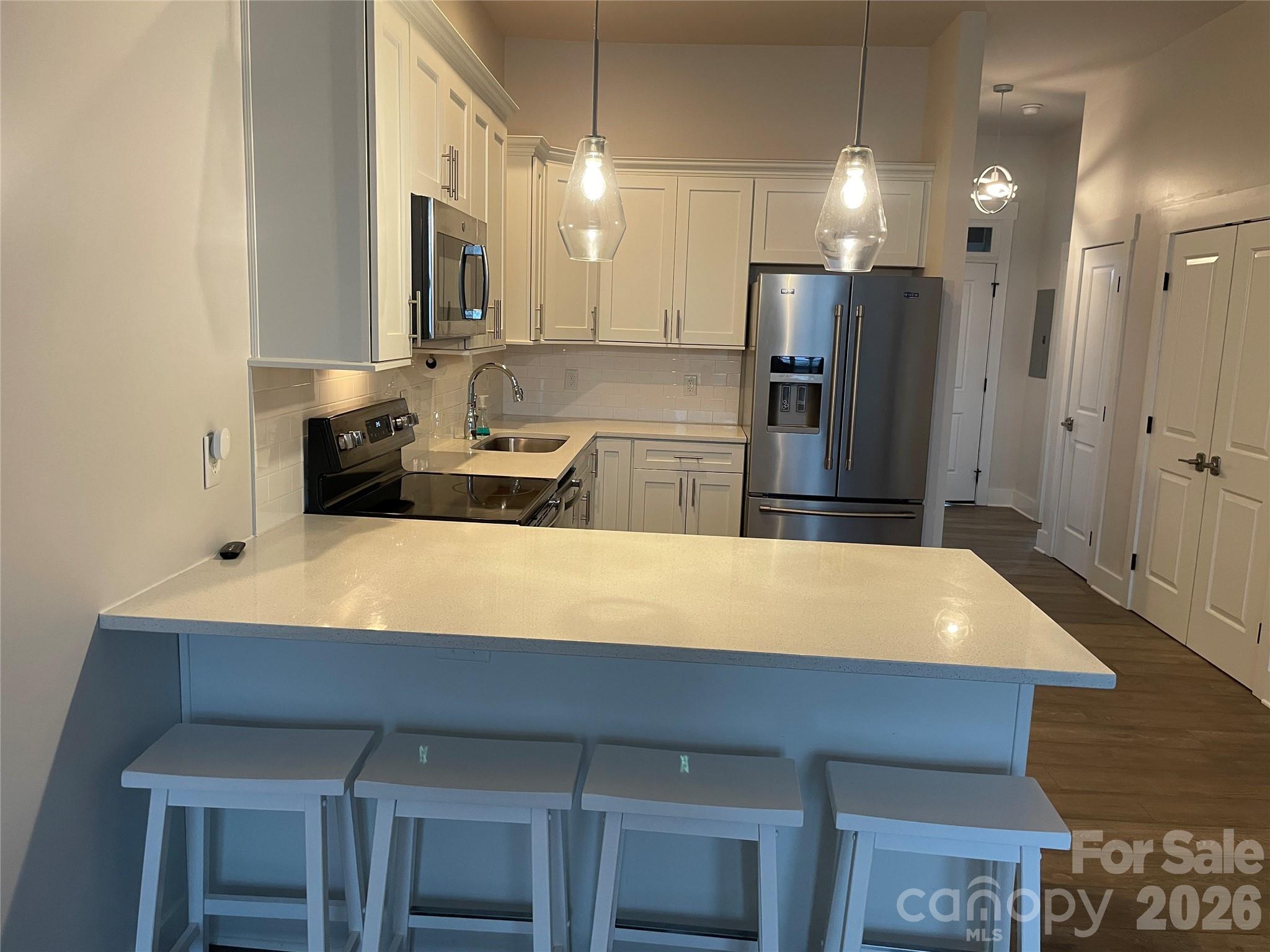 This Third floor unit, offers convenient urban living with luxury finishes like quartz counter tops, stainless appliances and 10-foot ceilings, featuring an open layout, primary suite with walk-in closet and private balcony. Third floor perks include no upstairs neighbors. Enjoy extra privacy with no footsteps above along with fewer shared walls for less noise and added security. This complex is located with easy access to uptown and local shopping/dining in the Cotswold community. This floor plan is open and spacious and bright with large windows that allow a bright airy feel. Sellers have relocated and this unit is ready for it's new owners.