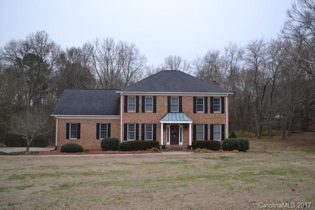 Pride of ownership shines with this home! Beautiful granite kitchen with work island/breakfast bar, formal dining room, great room with fireplace and a guest bedroom full bath on main level.  Upstairs is a large master with 2 walk-in closets, master bath with dual vanity, beautiful tiled shower, jetted tub.  Two additional bedrooms, hall bath, laundry room and huge bonus room! Great outdoor living with covered back porch, deck and patio. Lot goes well past fenced area.