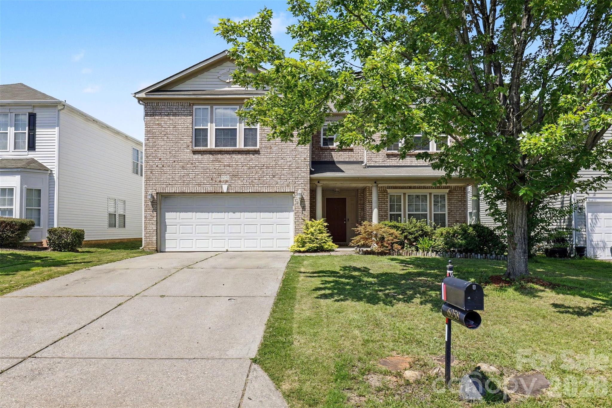 Don’t let the photos fool you—this spacious, well-maintained home with an attractive brick front is even more impressive in person! Located in the highly desirable Baxter Village community, this home offers the perfect blend of space, comfort, modern touches, and an unbeatable location.

Step inside to a welcoming formal living room at the front of the home, providing the perfect space for entertaining guests or creating a quiet retreat. Professionally installed luxury vinyl plank flooring provides a fresh, updated feel throughout the home - NO CARPET. A versatile downstairs room offers endless possibilities and can be used as a home office, playroom, guest space, or even a bedroom. The spacious family room features a cozy fireplace, creating the perfect gathering spot for relaxing evenings. The kitchen showcases beautiful amber cabinetry and a bar island, adding warmth, character, and functionality to the heart of the home.

Upstairs, you’ll find a large loft area and four spacious bedrooms, giving everyone room to spread out. The primary suite offers a private retreat with a bath featuring a standing shower and garden tub. Every bedroom features a walk-in closet with lighting and custom wire shelving, offering exceptional storage and organization.

Enjoy the oversized front porch, perfect for morning coffee or unwinding after a long day, along with a private fenced backyard ideal for entertaining, pets, or outdoor activities. The large downstairs laundry room adds everyday convenience, and the home has been professionally deep cleaned inside and out, making it truly move-in ready.

Perfectly situated in Baxter Village, you’ll enjoy easy access to shopping, dining, parks, community amenities, and major highways for a convenient commute to Charlotte and surrounding areas. All of this is located within the award-winning Fort Mill School District.

With its spacious layout, thoughtful features, and prime location, this home offers the lifestyle you’ve been looking for. Come see it in person—you won’t be disappointed!