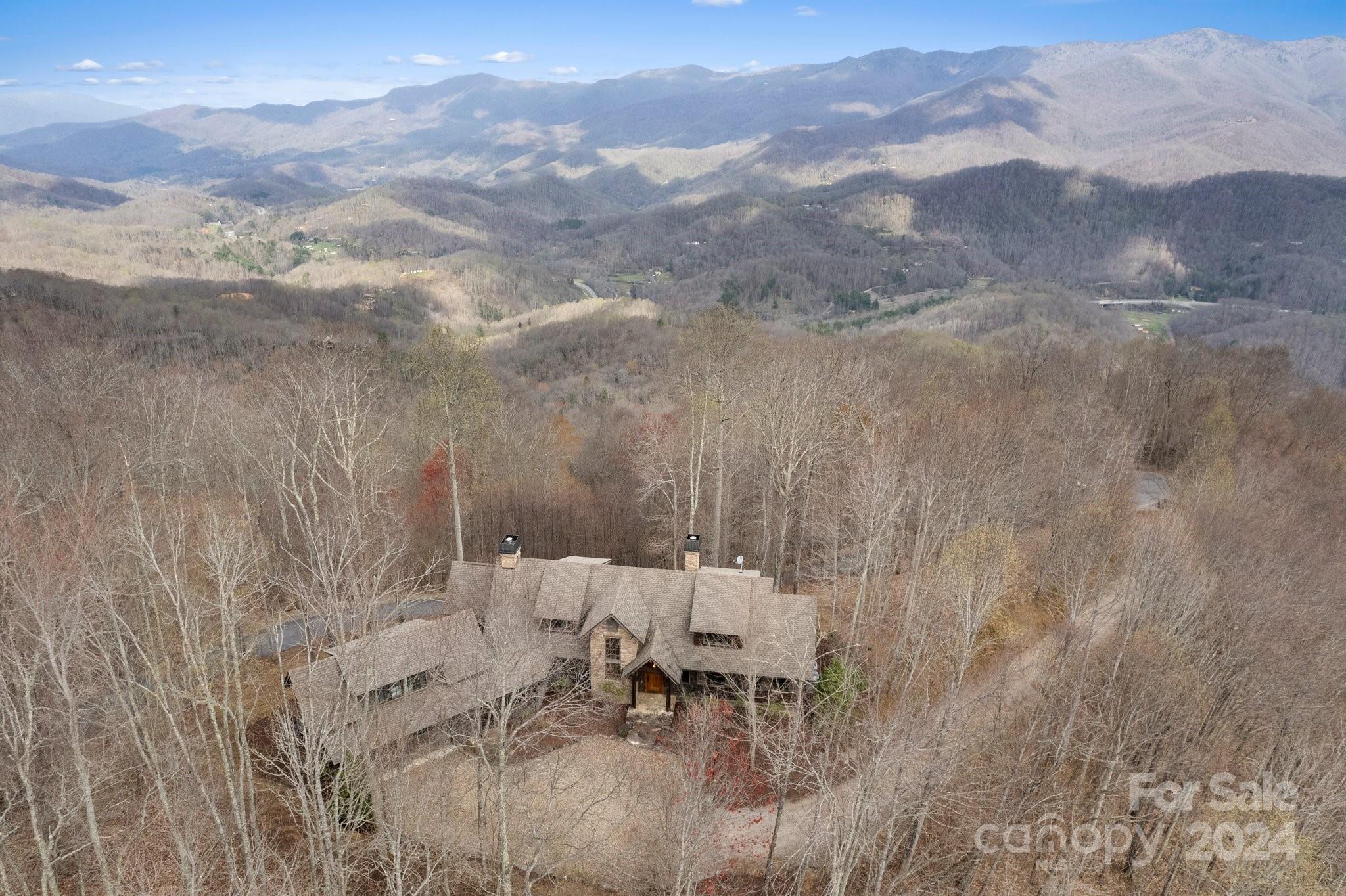 With gorgeous views that seem to go on and on, you’ll want to spend all of your time on the covered porch by the fireplace.  The open floor plan with natural light throughout is a hallmark of an Al Platt designed home.  Every room is sited to take advantages of the Eastern, Northern and Western views.  All four bedrooms are ensuite with the one over the garage just recently finished.  The location in the community couldn’t be better as you are close to the gates and all of the amenities, yet still at nearly 3,800 feet of elevation.  Privacy abounds in this location, as you’ll never see another home from any room.  This home is a must see!  Balsam Mountain Preserve is a private 4,400 acre club community with 3,200 acres of conservation land and completed amenities including an Arnold Palmer golf course, The Summit House and Mine Tavern restaurants, wellness and equestrian centers and over 40 miles of hiking trails.