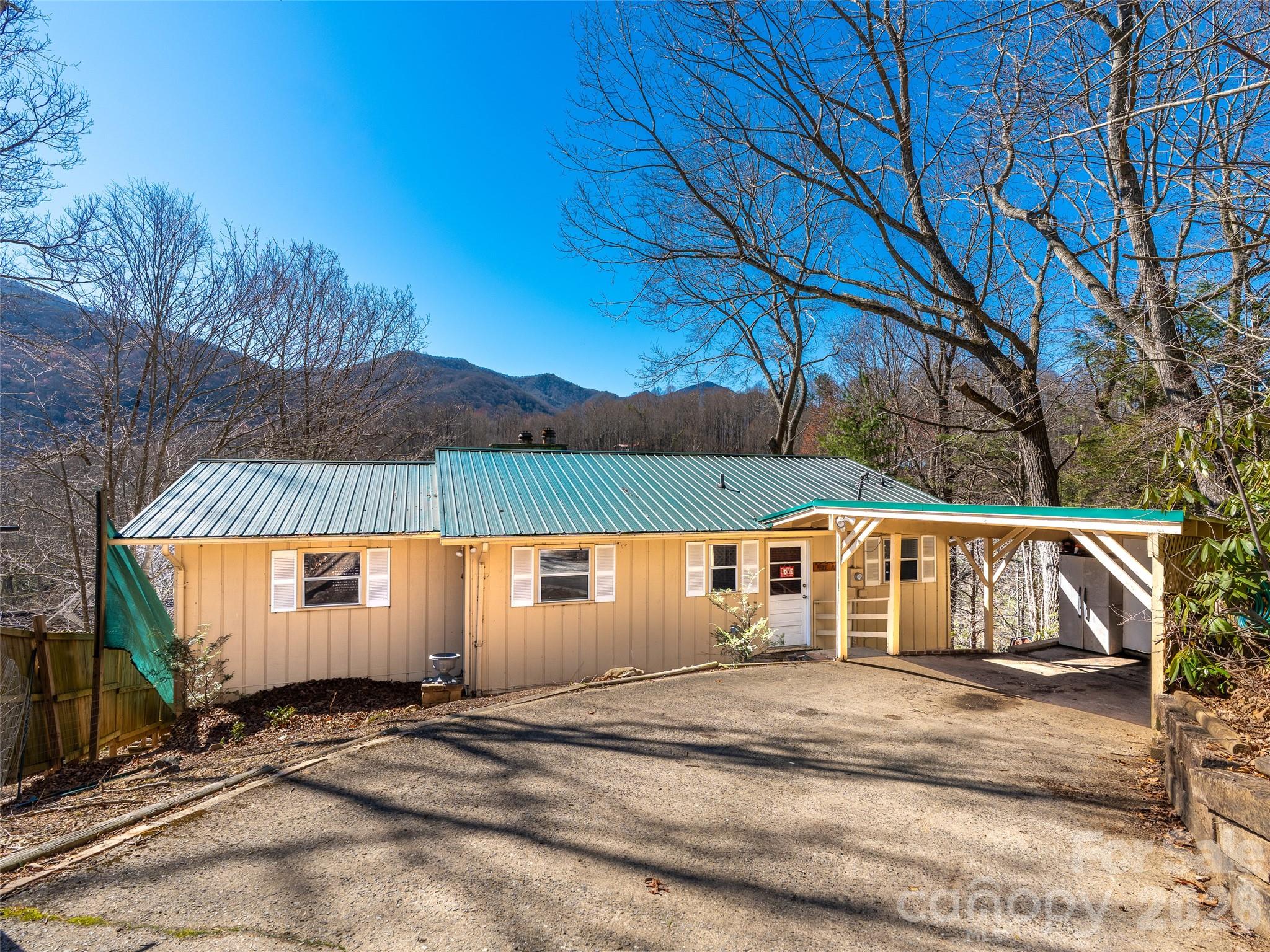 Positioned above Maggie Valley Club & Resort, this 2 bedroom, 2.5 bath mountain home sits on approximately 0.5 acres and captures mountain and golf course views.

The main level offers an open, comfortable living area along with a primary suite that opens directly onto the deck. Outdoor living is a highlight here, with a spacious two-level deck designed to take full advantage of the scenery and cool mountain air.

Recent improvements include a metal roof, updated HVAC system, new lower-level decking, fresh interior paint, and updated flooring. The layout provides flexibility for full-time living, a second home, or a short- or long-term rental opportunity.

Convenient to golf, dining, and area attractions while maintaining a private setting, this property offers the balance buyers look for in Maggie Valley.

New Roof in 2023
New H2O Heater 2020
Brand New HVAC system 2025