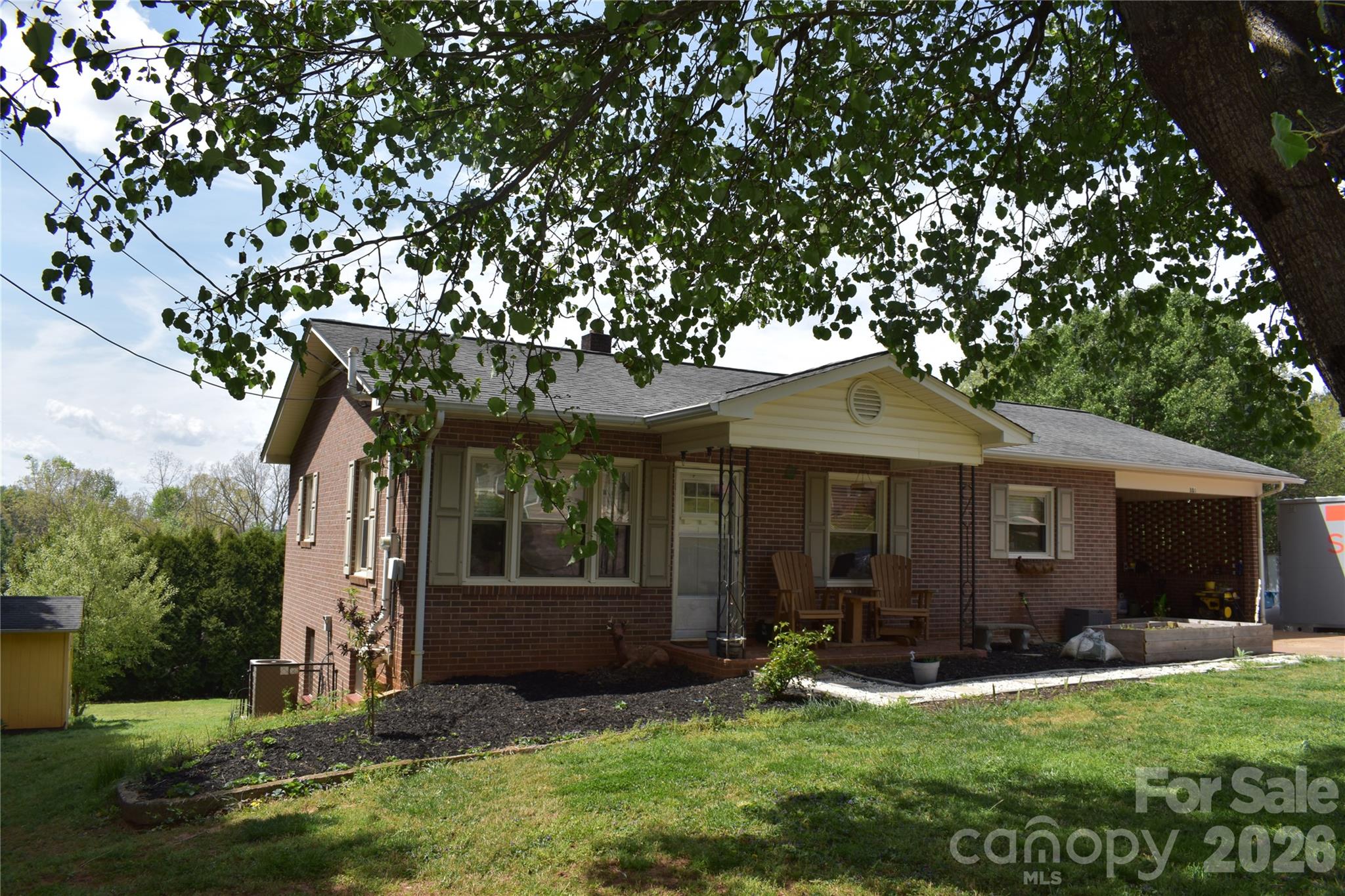 Convenient location - close to shopping, dining and interstate accessibility.  This move in ready 2 bedroom, 1 1/2 bath brick home has great features such as a full basement, 2 additional canning sinks in basement, carport, fully fenced level yard with mountain views and outdoor storage building/dog lot.  Other features include oil furnace, central air, hardwood & laminate floors and fresh paint.  Raised bed gardens await your personal use along with adequate space in the back yard for a full in ground garden and/or other outdoor activities.