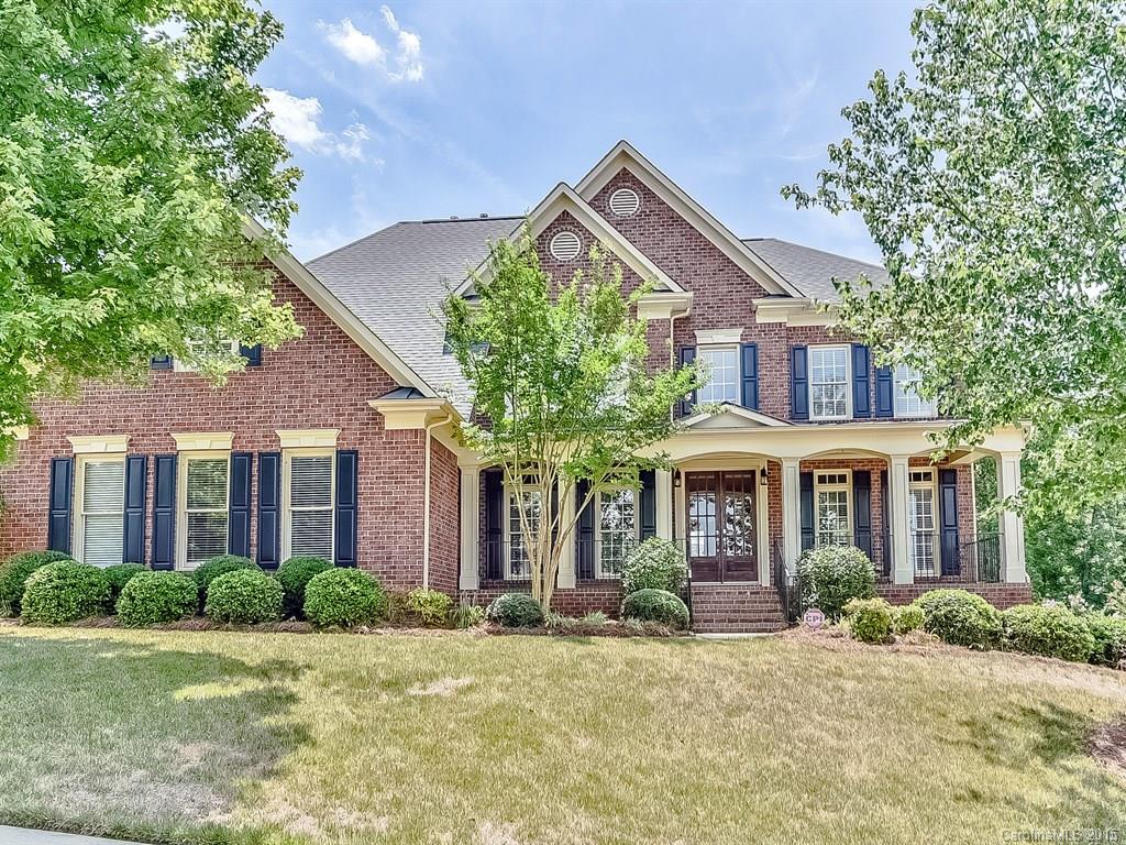 Graceful Brick BEAUTY Flowing with the Finer Features: heavy millwork, flowing hardwoods, wainscoting, arched doorways, palladium & transom windows, columns, open upper staircase, wood blinds, keyless entry & more. Gourmet Kitchen w/gas cooktop, wall oven, granite, tile, work island & brkfst bar. Luxurious Master Suite w/Sitting Area, Study & Exercise Area, his & her vanities, jetted tub and tile. LARGE Deck, 3rd Level READY for your Finishing touches. Set in amenity rich BridgeMill!