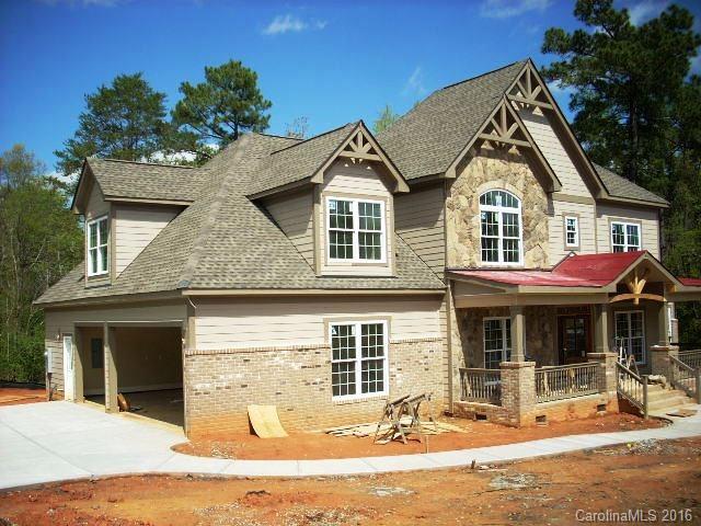 Open plan custom spec from quality builder Bill Denton. Choose hardwood and carpet colors. Stainless and granite kitchen with double oven and electric cooktop. Nice cubby by laundry. Formal dining, office or formal living, massive stone fireplace, master suite on main level. Large bonus room plus rec room up. 3 car garage in gate community. Walk 100 yards to pool and clubhouse on Lake Wylie. HOA has boat slips for lease.