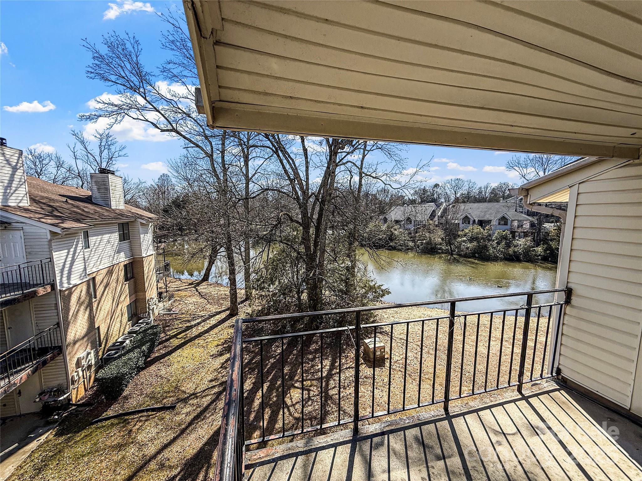 Welcome to this top-floor 2-bed, 1.5-bath condo with stunning lake views! Just minutes from Plaza Midwood, NoDa, and Uptown Charlotte, this move-in-ready home is perfect for buyers and investors alike. The bright, open floor plan is filled with natural light and scenic water views. The updated kitchen offers ample cabinetry and counter space. The primary bedroom has en-suite access to the full bath, while the second bedroom is great for guests, a home office, or extra living space. Enjoy your private, covered balcony, perfect for morning coffee or evening relaxation. Water is included with the HOA, and the community offers assigned parking and quick access to I-77, I-485, and Uptown. INVESTORS take note: A portfolio of high-yield rental properties (including this one) are available—contact the listing agent for a bulk purchase discount + details. Top-floor units here with a lake view rarely hit the market, so don’t miss out - schedule your showing today! Recent rental comps are between $1300-1600.