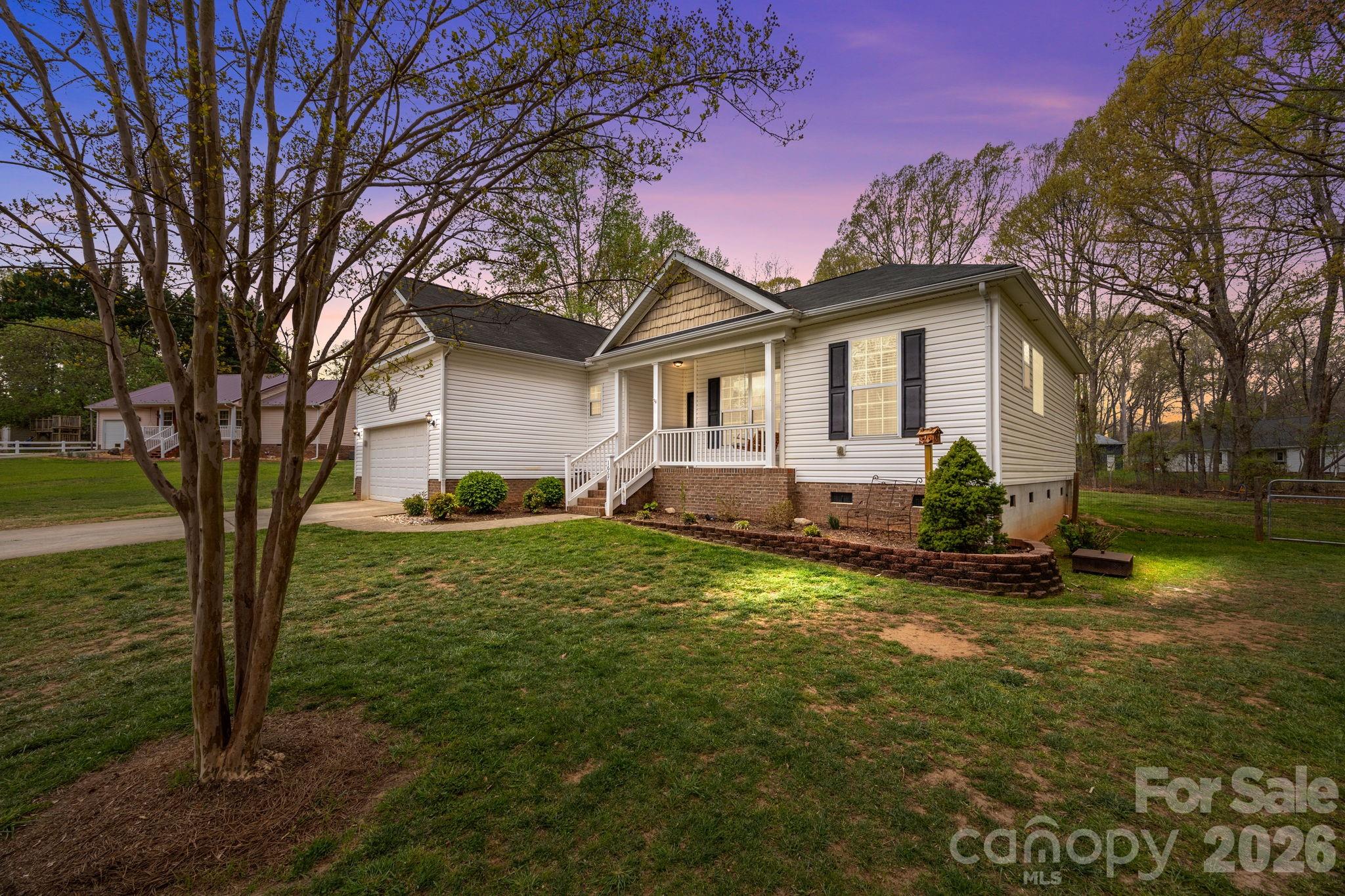 Welcome home to this beautifully maintained 3-bedroom, 2-bath ranch nestled on a quiet cul-de-sac in desirable Lincolnton, North Carolina. Perfectly situated just minutes from local eateries, shopping, and everyday conveniences, this home offers both comfort and convenience in an inviting setting.

Step inside to discover a thoughtfully designed split floor plan with a spacious and functional layout. The main living area features vaulted ceilings that create an open, airy feel, complemented by a stunning stone fireplace that serves as the focal point of the space—perfect for cozy evenings at home.

The well-appointed kitchen flows seamlessly into the living and dining areas, making it ideal for entertaining or everyday living. A bright and relaxing sunroom provides the perfect spot to unwind, enjoy your morning coffee, or take in views of the peaceful surroundings year-round.

The primary suite offers privacy and comfort, while the additional bedrooms are well-sized and versatile. Outside, the cul-de-sac lot provides a quiet, low-traffic environment with plenty of space to enjoy.

A standout feature of this property is the impressive 24x30 detached workshop/garage—ideal for hobbyists, storage, or additional workspace.

This home truly combines charm, functionality, and location—don’t miss your opportunity to make it yours.