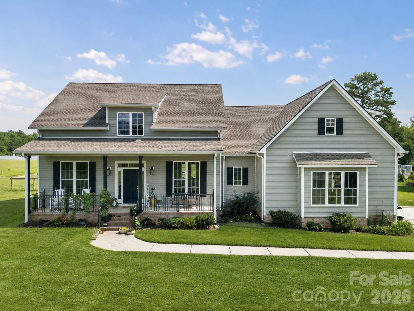 Meticulously maintained and beautifully appointed, this stunning 3-bedroom, 3.5-bath home is nestled on approximately 2.5 acres in the peaceful countryside of Edgemoor. Built in 2023 and thoughtfully cared for since, this property offers the perfect blend of modern construction, functional living space, and room to enjoy the outdoors.

Inside, you'll find a bright and inviting open-concept floor plan featuring luxury vinyl plank flooring throughout the main living areas, soaring ceilings, abundant natural light, and picturesque views of the surrounding property. The spacious great room flows seamlessly into the well-appointed kitchen, complete with granite countertops, stainless steel appliances, a large center island with seating, walk-in pantry, and generous cabinet storage. The desirable split-bedroom layout provides privacy for the primary suite while offering two additional bedrooms on the main level.

Upstairs, you'll find a spacious finished bonus room with a full bath that is currently configured as a home office while also accommodating a bed. This versatile space offers endless possibilities to suit your lifestyle, whether as a home office, guest retreat, media room, playroom, fitness room, hobby space, or additional living area. The formal dining room showcases elegant trim work and serves as the perfect setting for gatherings and special occasions. Additional features include a spacious laundry room, attached side-load garage, and ample storage throughout.

Step outside and enjoy true country living from the covered front porch or the covered rear porch, which extends to a spacious open-air deck overlooking the backyard and surrounding acreage. With direct access from the deck to the yard below, the outdoor living spaces are ideal for entertaining, relaxing, gardening, pets, or simply enjoying the peaceful surroundings. A portion of the backyard is already fenced, offering additional functionality while maintaining the open feel of the property.

Surrounded by other quality homes on large lots, you'll enjoy the privacy of rural living while remaining conveniently located to I-77 for an easy commute. If you've been searching for acreage, modern finishes, and a home that has been exceptionally maintained, this move-in-ready property is one you won't want to miss. Schedule your private showing today!