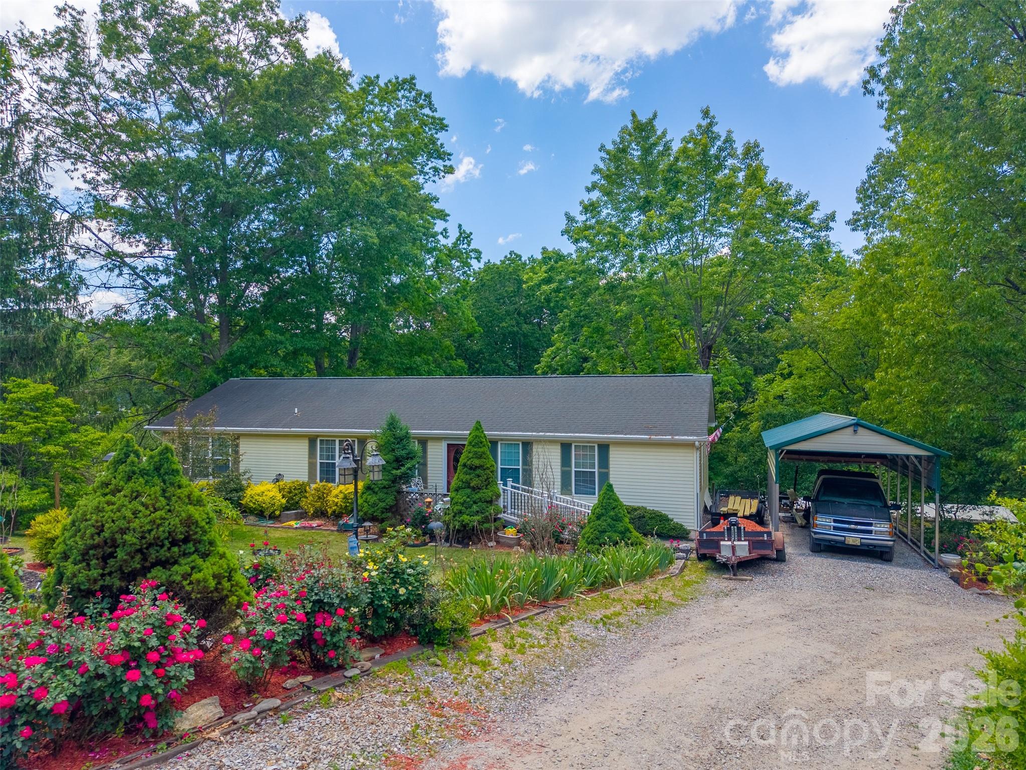 Investment opportunity in the heart of Clyde! This unique package includes 90, 106, and 132 Hennessee Street, offering multiple parcels with excellent potential for rental income, home business, or other uses. Located just minutes from Downtown Clyde, Canton, and Waynesville, this property combination provides convenient access to shopping, dining, schools, and I-40 for an easy commute. 90 Hennessee Street features a one-level living residence with 3 bedrooms, 2 baths, heat pump, vinyl exterior, and an additional multi-use room offering flexibility for office space, hobbies, or additional guest space. 106 Hennessee Street includes a 2 bedroom/2 bath mobile home with carport and large covered back porch, offering comfortable living or rental potential. 132 Hennessee Street features a two-bay garage with full bath and washer/dryer, plus an abundance of cabinetry creating the ultimate workshop space. Finish the right side for additional rental opportunity. The entire property has been meticulously maintained with new and mature landscaping and features a circular driveway providing easy access to each parcel. Additional improvements include two RV hookups with 30 amp electric service, one of which also includes water and sewer connections. Parcels are serviced by city water, city sewer, and trash pickup. Together, these properties create a rare opportunity for investors, contractors, or buyers seeking multiple homesites in a growing Haywood County location.