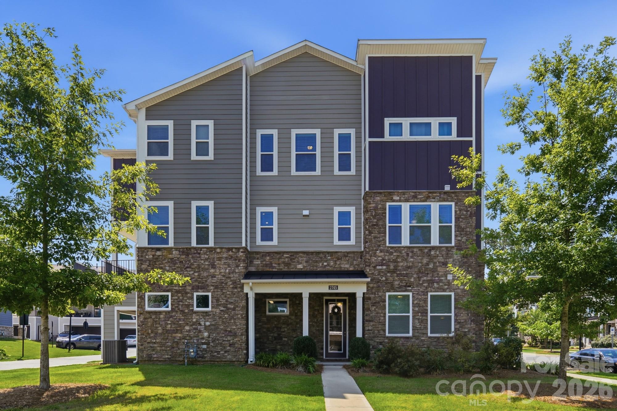 IMMACULATE! Urban style end unit town home near the heart of Charlotte in the University Research Park area. Modern finishes with lots of windows, natural light & neutral beige paint throughout. Large chef's kitchen with gas cooktop, sleek wall oven/microwave combination, walk in pantry, plenty of storage and a huge island. Tired of painted white or gray cabinets... this stylish kitchen includes espresso stained maple cabinets with beautiful countertops of white & earth tone granite. Entertaining is a breeze in this open floor plan with additional space to relax on the covered porch off the dining area or downstairs in the main level rec room. Home includes a guest BR & full bath on the 2nd level and the primary suite with a large walk-in closet and two additional spacious BRs on the 3rd level. The garage is insulated, drywalled and is oversized with approx 6x12 extra storage area. Refrigerator, washer & dryer are included. Enjoy the community pool & walking trails! The location is so convenient to uptown, the airport, Mallard Creek Greenway, restaurants, shopping, I-85 and I-485. The Seller is offering a $5000 CREDIT towards Buyer's closing costs. Be sure to watch the virtual tour. Don't miss this great home, schedule your showing today!!