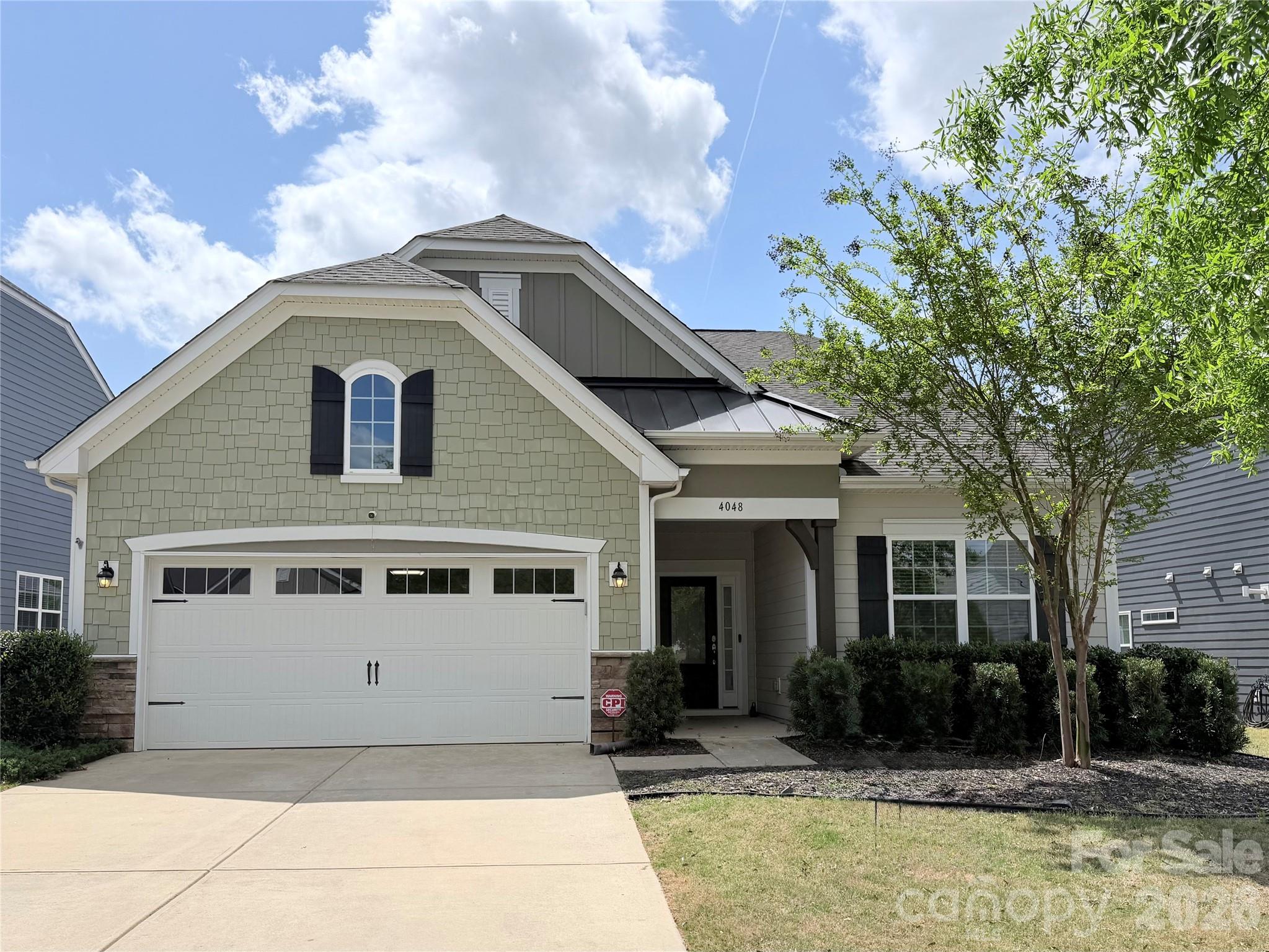 Welcome home to this beautifully maintained home in the sought-after Summerhouse at Paddlers Cove, just minutes from Lake Wylie and located near highly-rated schools. With 3 bedrooms, 3 full baths, and a flexible 1.5-story layout, this home offers comfort, style, and versatility.

The main level features a spacious kitchen with a large island, granite countertops, and a double oven, perfect for entertaining or everyday living. The living area is anchored by a cozy fireplace and flows easily to the screened porch and paver patio, creating a great space to relax or host guests. The fenced backyard offers a functional outdoor space for pets, play, or gatherings.

Upstairs, an oversized loft, bedroom, and a full bath provide the ideal setup for a guest suite, home office, media room, or private retreat. Additional highlights include fiber cement siding, a tankless water heater, freshly deep-cleaned carpets, and a newer garage door opener installed in 2024.

Residents enjoy access to community amenities including pools, playgrounds, walking trails, and paddlesports access to Lake Wylie on the Paddlers Cove side, offering a unique outdoor lifestyle right in your neighborhood. Residents can also enjoy nearby Field Day Park, featuring pickleball courts, athletic fields, walking trails, playgrounds, shelters, and community gathering spaces.

With summer here, this is a great opportunity to start enjoying everything this home and community have to offer. Schedule your showing today!