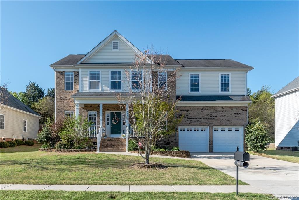 Fabulous 5 bedroom 3 full bath home with open floor plan.  Hardwoods in formal Living Room, Dining Room, foyer, and great room.  Kitchen has ceramic tile, custom cabinetry with roll-out shelving, island, and pot rack.  Guest bedroom and full bath on main. Home has two new HVAC units in 2014/2015.  Huge deck that overlooks yard that backs to woods.  Relax on the rocking chair front porch. Close to interstate, restaurants and shopping. Home shows like a model!!
