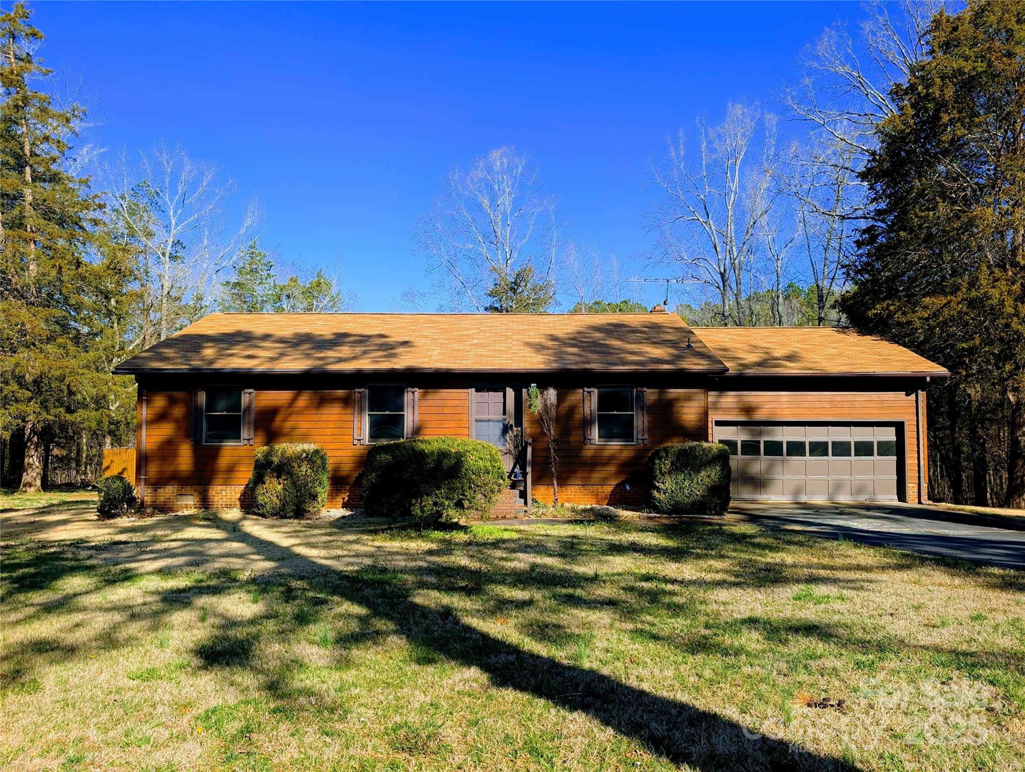 Welcome to southern living and charm! Nestled on a sprawling 2.39-acre lot, this delightful 3-bedroom, 2-bathroom residence offers the perfect blend of comfort and tranquility. The property boasts a private pond, providing a serene backdrop for your everyday life. This home is just a short drive from local schools, shopping, and dining options. Don't miss the opportunity to make this beautiful property your own!