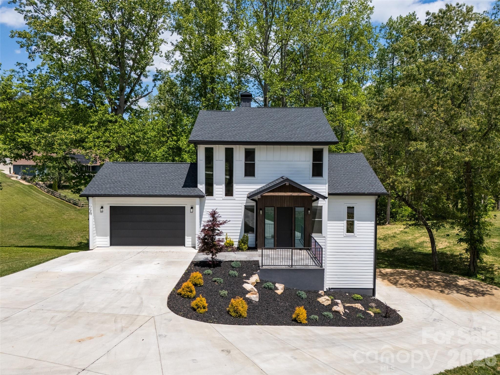 Located within a private, gated community, this residence offers an exceptional blend of security and tranquility. The property sits directly adjacent to a scenic pond, providing soothing water views from multiple vantage points throughout the home. Experience the ease of no-step entry into the main level. This thoughtfully designed, easy-flowing layout is perfect for those prioritizing accessibility and effortless movement. The walk-out basement is a true standout, functioning as a completely self-contained living suite including a garage, kitchen, laundry and a bedroom. This space is ideal for multi-generational living, or long-term guests.