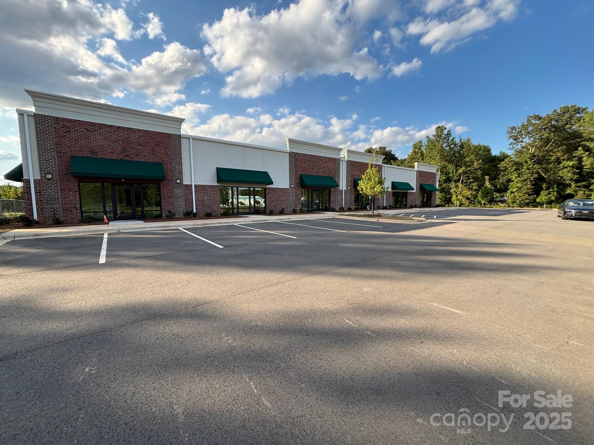 Brand New Building with over $750,000.00 worth of interior office build-out. Due to multiple[le delays, the tenant terminated their lease. We have received our corticate of occupancy Available for sale or lease. Attractive offices, break room, conference room and meeting space. 5,500 SF of warehouse with four dock doors and one drive in door. Ample parking. 6,500 SF of office space . All offices 100% heated and cooled with 25 tons of HVAC. Brand new Construction  12, 000 SF.? Located on Wesley Chapel Stouts Road a very heavily traffic Road between Sun Valley High school on Monroe Road and Lowe's on Highway 74 , Independence Road, the most travel road in North Carolina.? Close to I-485 which will take you to both I-85 and I-77.. Agent is one of the owners