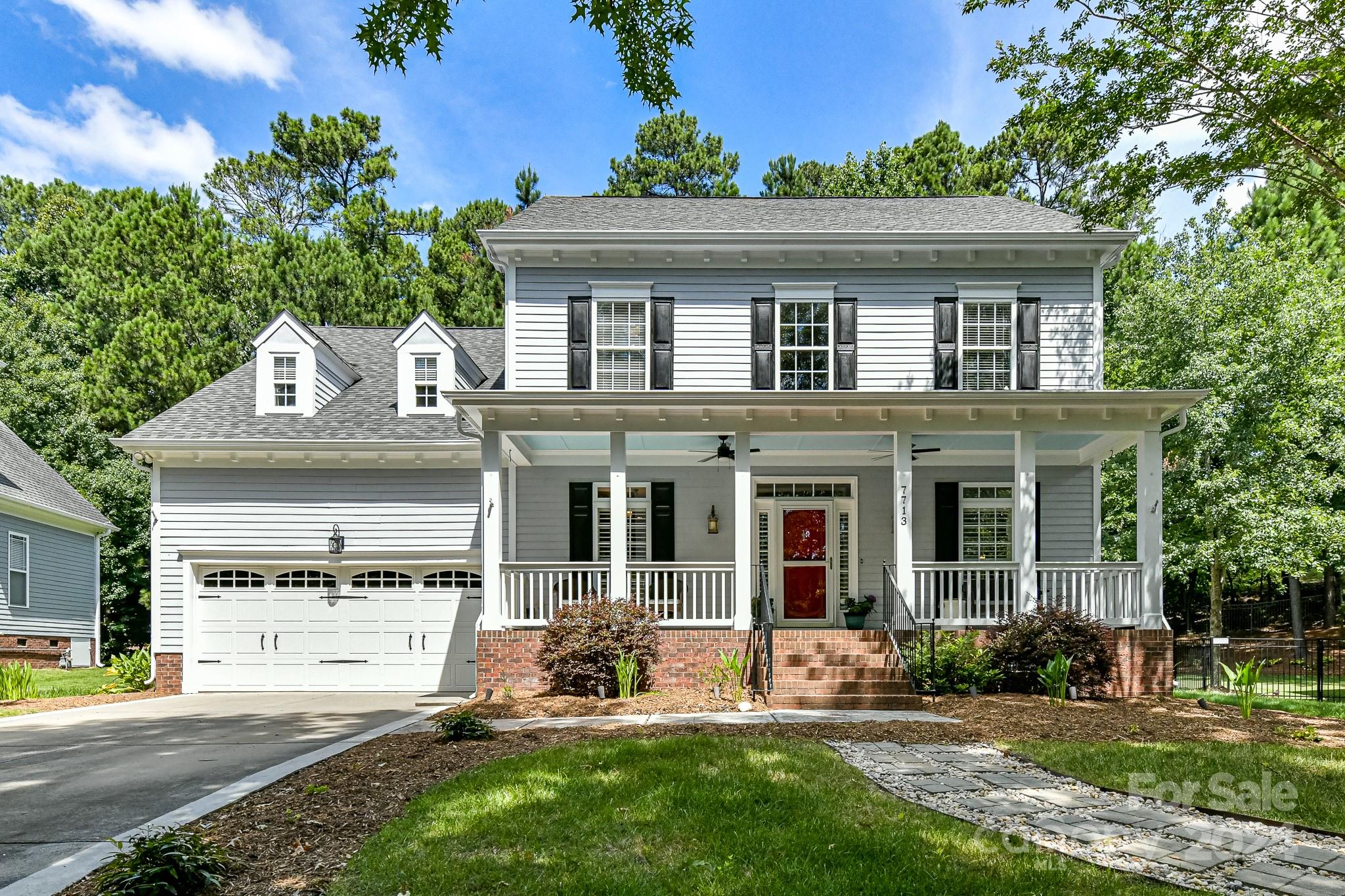 Wait until you see this immaculate home located in the sought-after Lake Shore in Tega Cay. This classic southern style Saussy Burbank home is the one you have been looking for! Unwind with a glass of sweet tea on the massive front porch and enjoy the two-story foyer, dining room & office as you enter the home. The gleaming site finished hardwoods, lead you into a generous sized kitchen w/concrete countertops, subway tiled backsplash & stainless-steel appliances. The Kitchen is open to the two-story great room & breakfast area. Primary bedroom w/ vaulted ceilings with en-suite is located on the main floor with 3 additional bedrooms upstairs & a large bonus room. Check out all the walk in storage! Outside you'll find a large deck and a huge paver patio! Great for all those get togethers! Tega Cay is a one-of-a-kind neighborhood, with so much to do. Miles of walking trails which are just steps from the home. Tennis courts, golf courses, lake access and so much more. Y'all better hurry!