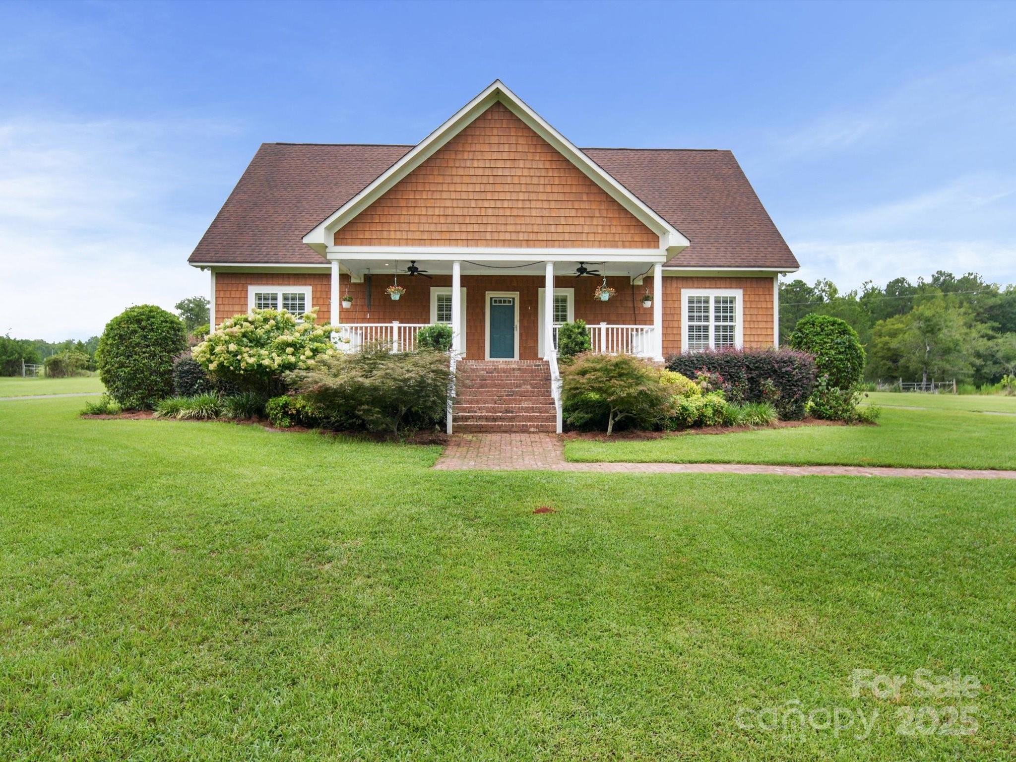 If privacy and space are what you’re after, look no further. On 11 serene acres, this stunning 5-bedroom, 4.5-bath home offers the perfect blend of comfort, functionality and upscale features. Step into a spacious great room with gleaming hardwood floors and an open split-bedroom floor plan, perfect for both everyday living and entertaining. The spacious kitchen boasts granite countertops, and stainless steel appliances, designed for both style and efficiency. Upstairs, you’ll find two additional bedrooms, a full bath, and a large rec room, ideal for family fun or guest accommodations. Outside, a massive workshop with three covered storage bays provides endless possibilities—whether for hobbies, storage, or business needs. Just minutes from the natural beauty and recreation of Lake Wateree and Wateree River, this home truly has it all—space, style, and seclusion. ADDRESS is 1393 WATEREE DAM ROAD RIDGEWAY SC 29130
