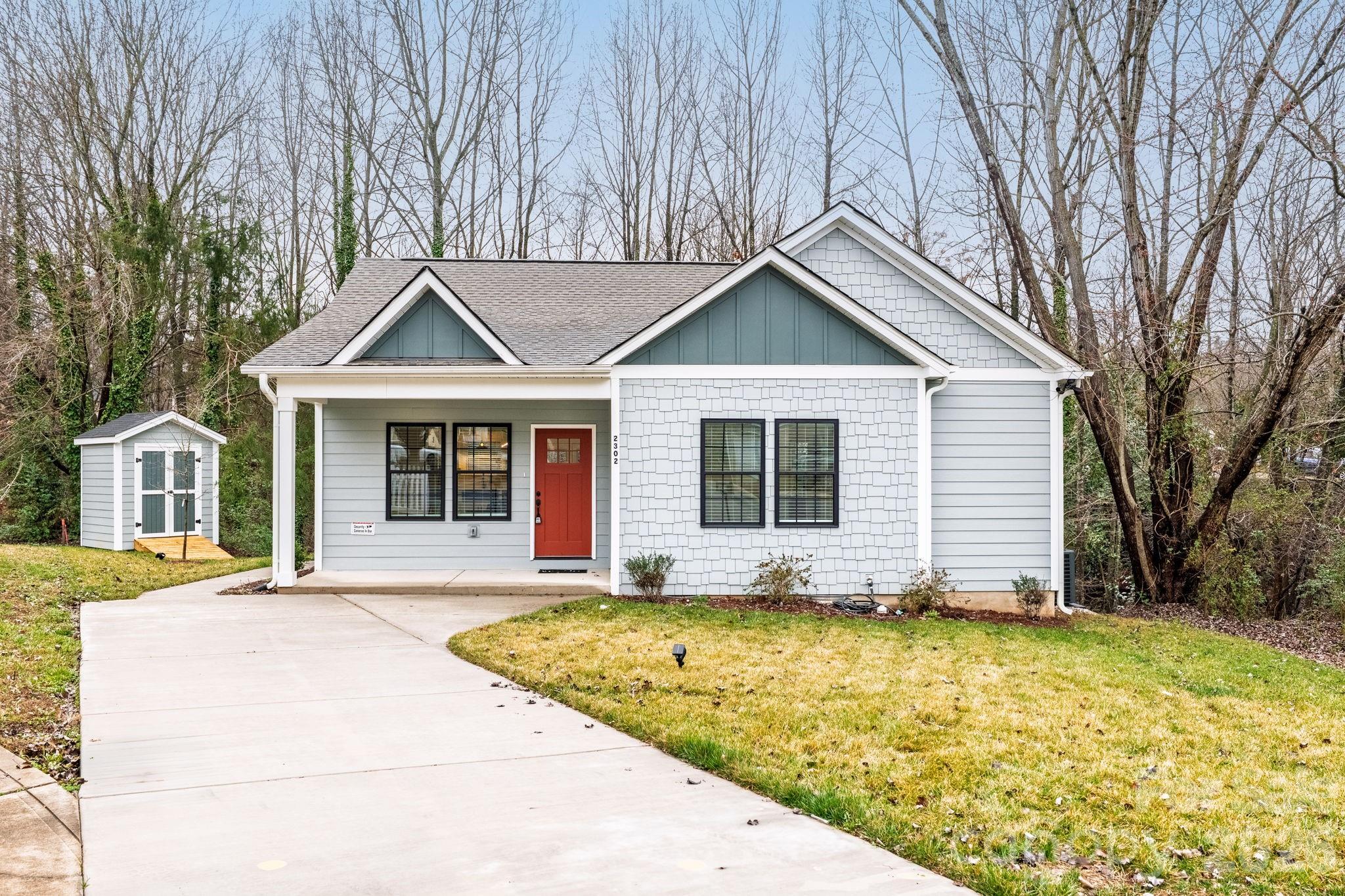 ** THIS HOME QUALIFIES FOR THE PATH PROGRAM, WHICH IS A 100% FINANCING OPTION WITH NO PRIVATE MORTGAGE INSURANCE**  Tucked away in a quiet cul-de-sac and surrounded by mature trees, this newly constructed ranch blends modern elegance with everyday comfort. Inside, a thoughtfully designed open floor plan showcases rich hardwood floors, detailed crown molding, and a cozy fireplace that anchors the main living space.
The chef-inspired kitchen is the heart of the home, featuring stainless steel appliances, granite countertops, a striking tile backsplash, and seamless flow into the living and dining areas-perfect for entertaining or staying connected with family and guests. The spacious owner's suite offers a private retreat with dual vanities, an oversized walk-in closet, and a spa-like bath complete with porcelain tile flooring and a beautifully designed
walk-in shower. Secondary bathrooms continue the home's elevated feel with modern finishes and quality craftsmanship throughout.
Step outside to your own peaceful backyard oasis. The deck is nestled among mature trees, providing exceptional privacy for gatherings or quiet evenings at home. If you listen closely, you may even hear the gentle sound of a nearby creek, adding to the home's serene setting. A convenient storage shed adds valuable space for tools, lawn equipment, or seasonal storage.
Ideally located with easy access to I-85, I-485, and I-77—and just minutes from Uptown Charlotte, University of North Carolina at Charlotte, the light rail, Bank of America Stadium, and Spectrum Center-this home offers the perfect balance of tranquility and convenience.
Featuring high-end finishes throughout, this is the one you've been waiting for!