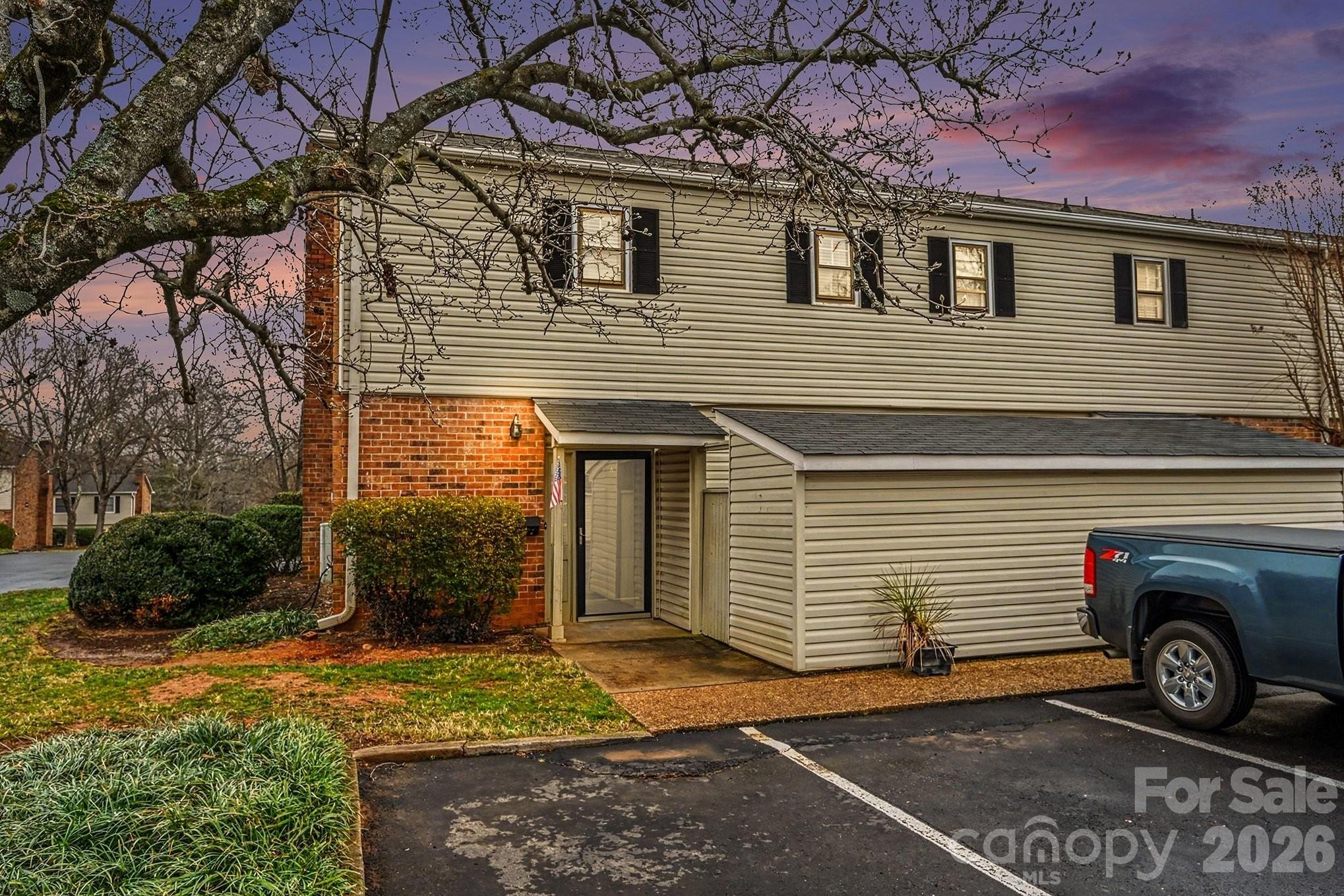 End unit in the heart of South Charlotte's most walkable corridor — minutes from SouthPark, Whole Foods, Phillips Place, and the Little Sugar Creek Greenway. This 2-bed condo offers 1,175 sq ft of move-in ready living with a brand new HVAC system (2025), updated bathrooms, wood burning fireplace, and all kitchen appliances included. The open main level flows to a private rear patio with fenced yard; upstairs features two bedrooms with generous closet space. Two assigned parking spaces. Community pool and clubhouse. HOA covers exterior maintenance and landscaping — low-maintenance living without the tradeoffs. Rentals permitted for terms of one year or longer — ideal for long-term investment. FHA and VA financing eligible. Seller open to contributing toward buyer closing costs or rate buy-down — ask for details.
