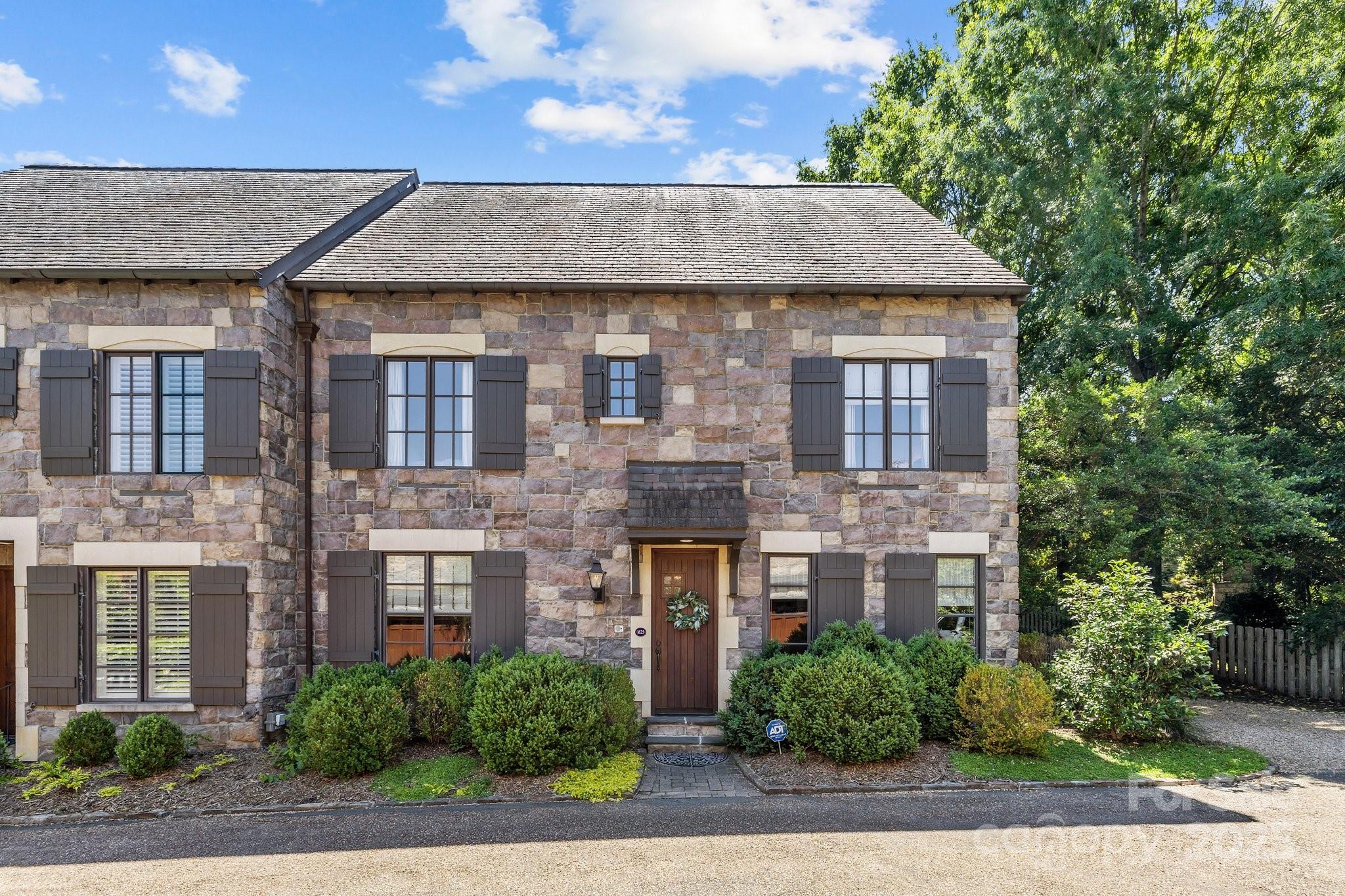 Fabulous end-unit luxury townhome with elevator in Myers Park! A floor plan that seamlessly blends living, dining, and entertaining spaces, perfect for both everyday comfort and hosting. The open kitchen complete with high-end appliances, including a Viking Gas Range & built-in Miele coffee machine along with sleek quartz countertops & a spacious island opens into a great room & breakfast/sitting area with wonderful natural light. A stylish wet-bar connects the great room with a front living or office area. The primary suite is a retreat featuring a spa-like bathroom with dual vanities, soaking tub, walk-in shower & spacious closet. Each bedroom offers en-suite baths and ample closet space. The 3rd level has a full bathroom providing flexibility for bedroom, bonus/exercise or office space. Step outside onto a private patio with outdoor fireplace overlooking the community gardens & 3-car detached garage!