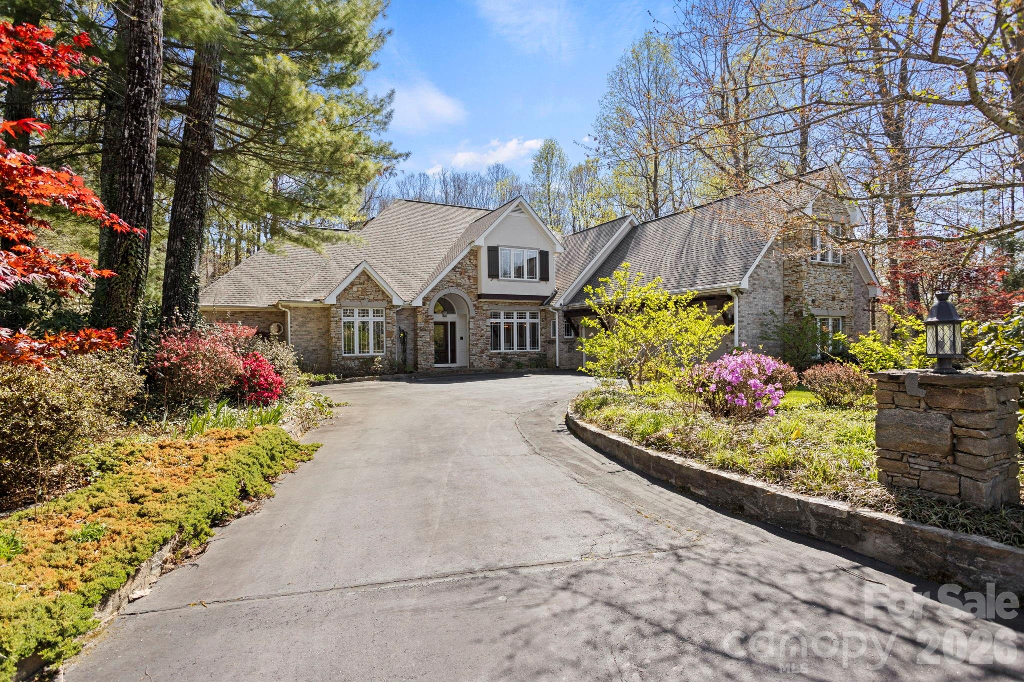 Stunning Estate Home in Prestigious Kenmure Golf Community. Experience luxury mountain living in this exceptional home located in the highly sought after Kenmure- a gated golf course community. Perfectly positioned on 1.3 private acres on a cul-de-sac, this beautifully designed 4-bedroom, 5 full bath, 2 half bath residence offers the ideal blend of elegance, comfort, and functionality—with space for every lifestyle need. From the moment you arrive, you'll appreciate the level driveway, welcoming entry and fully fenced backyard—ideal for pets, play, and outdoor enjoyment. Inside, the home showcases impressive architectural details, soaring vaulted ceilings, rich hardwood floors and thoughtful craftsmanship throughout. The main level centers around a breathtaking great room featuring cathedral ceilings with exposed beams, a dramatic wall of windows with Palladian window accents, custom built-ins, and a floor-to-ceiling stone fireplace—creating a warm and inviting setting for entertaining or relaxing. The chef’s kitchen is truly extraordinary, offering abundant cabinetry and counter space, premium stainless steel appliances, sub-zero refrigerator/freezer, oversized gas cooktop with griddle, custom exhaust hood and double wall ovens-both of these framed by stunning brickwork, center island with prep sink and breakfast bar, plus a Butler’s pantry/bar area with beverage refrigerator. The luxurious primary suite is a private retreat featuring vaulted beam ceilings, spa-inspired bath with garden tub, walk-in tiled shower with multiple shower heads, dual vanities, and two walk-in closets. Additional main-level highlights include: breakfast room and elegant dining room with tray ceilings, private den/study, spacious office area, huge laundry room with sink, cabinetry and workspace and two powder baths. Upstairs, guests and family will enjoy three additional bedrooms, three full baths, and a large bonus/flex room with closet. The lower level is designed for recreation and relaxation with: large family room with fireplace, wet bar area, billiards/game room, full bath and two expansive storage/workshop areas. Outdoor living is equally impressive with a screened porch, open deck, lower patio/deck, and hot tub, all overlooking the beautifully landscaped fenced yard. Additional features include a two-car plus golf cart garage, newer roof and a prime location convenient to Kenmure’s amenities and gate access. This remarkable property offers a rare opportunity to own a luxury mountain home with unmatched space, style, and versatility.