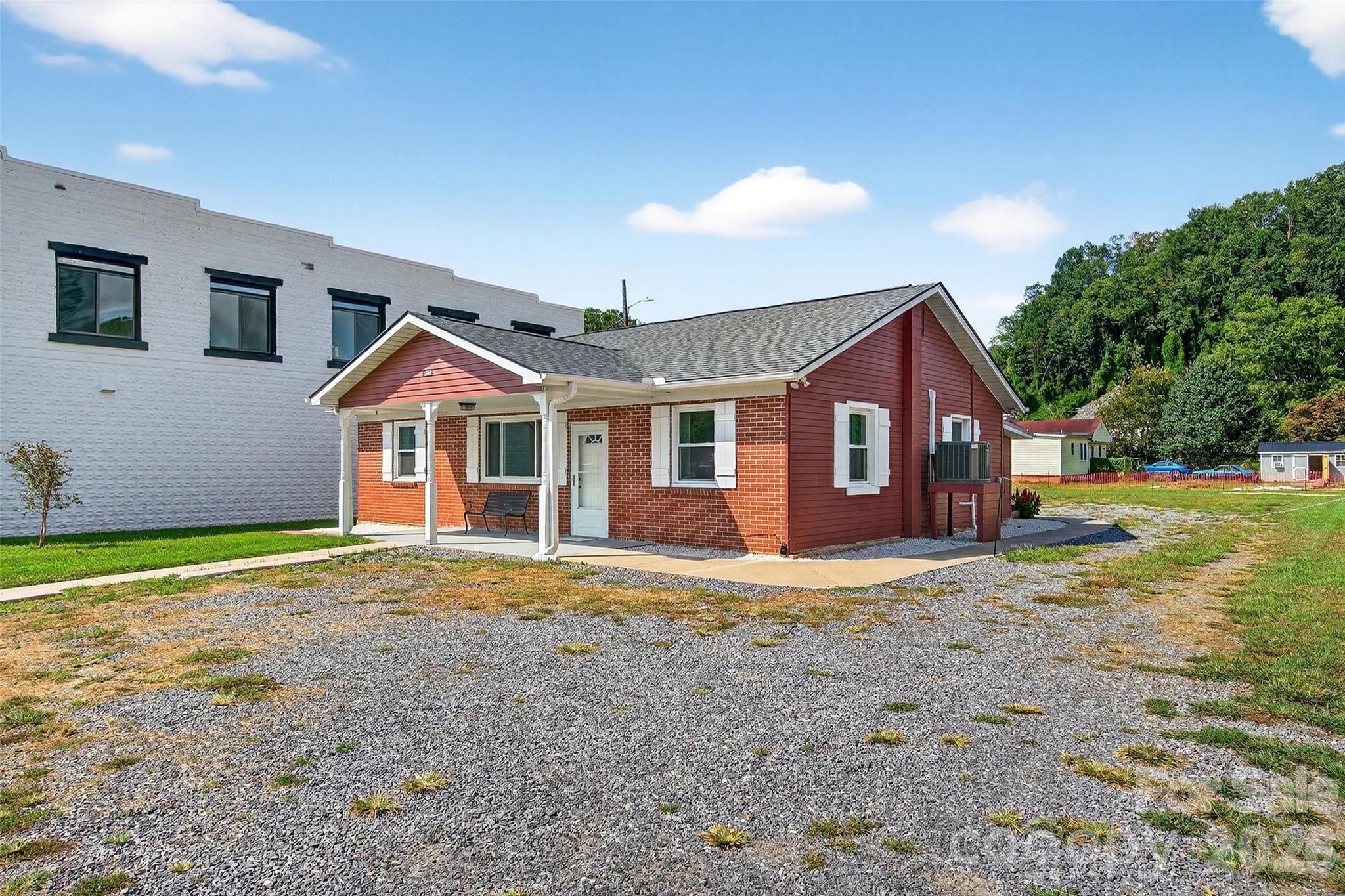 **Price Improvement on this versatile home in Old Fort!** Walkable to everything, this property offers a great work-from-home opportunity with a large lot—or simply enjoy the spacious yard. The possibilities are endless.

Just in time for spring buyers looking for a place to live and work, this is your chance to own a piece of this vibrant mountain town known for its outdoor adventures. This newly updated, **move-in ready** 3-bedroom, 1-bath brick ranch sits on a spacious city lot along Catawba Avenue.

The home is connected to city water and sewer. While it sustained damage from Helene, it has since been completely and beautifully renovated.

Fun fact: this property once served as Old Fort’s local chiropractor’s office for many years, making it a unique part of the town’s history.

Whether you’re looking for a comfortable residence or a live-and-work opportunity, this location delivers. The property features excellent Catawba Avenue frontage with ample parking—and potential space to build an additional structure.

A rare opportunity to own a home that can be used for residential or potential commercial purposes. Truly a blank canvas for your next chapter.

**Schedule your showing today!**