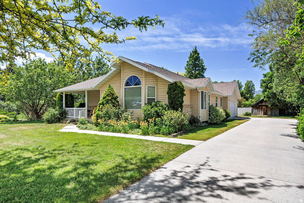 Fabulous Hyrum home around the corner from the reservoir. Mature landscaping, fruit trees, flowers, and lovely shade to enjoy summer evenings on the oversized front or back patio. 6 bed/3 bath, endless storage space throughout, and two sheds out back. The great room is ideal for gatherings, and boasts a lovely gas fireplace. Potential 3 bed/1 bath mother-in-law apartment or ADU in the basement. 0.28 acre, buildable lot to the south being sold separately or as a package deal with a discount. Schedule a visit soon and get ready to enjoy your little slice of heaven.
