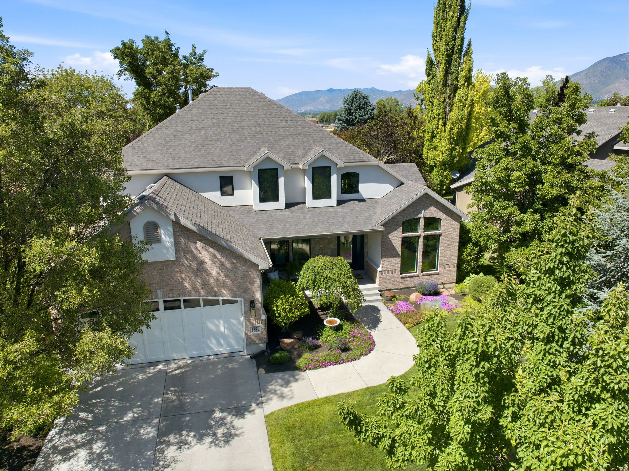 Rarely available in the Woodstock Meadows neighborhood, this beautiful two-story home is nestled on a quiet, tree-lined street and has been lovingly cared for by the same family for more than 21 years. Warm, sophisticated, and thoughtfully designed, the home offers inviting spaces perfect for entertaining as well as comfortable everyday living. The kitchen is truly the heart of the home, featuring custom cabinetry, Bosch stainless steel appliances, a Sub-Zero refrigerator, and stunning Taj Mahal countertops. The spacious great room flows seamlessly from the kitchen to the dining and living areas, creating an ideal setting for gatherings and daily life alike. Step outside to enjoy the expansive deck and patio, offering private outdoor living space perfect for relaxing or entertaining in your own backyard oasis. The beautifully appointed primary suite features a spa-like bath. Thoughtfully renovated, every detail has been carefully curated with intention and quality craftsmanship. Interior updates include new paint throughout from ceiling to floor, updated kitchen countertops, backsplash, sink, and hardware, as well as all new tile, countertops, sinks, hardware, toilets, and lighting in the bathrooms and laundry areas. Solid wood core doors are featured throughout the home. Exterior improvements include new stucco, Pella windows and doors, an updated deck, and a hot tub. Nestled in a peaceful neighborhood, this home offers unparalleled comfort, energy efficiency, and elegant living, all with easy access to Utah's world-class skiing, hiking, and biking in the nearby mountains, as well as Salt Lake International Airport. The property is just minutes from Fashion Place Mall, Sports Mall, Awaken Studios, and the popular Sunday Farmers Market at Wheeler Farm. Convenient freeway access makes commuting throughout the valley simple and efficient. Located within walking distance of Woodstock Elementary, a Granite School District designated gifted and talented school, and just minutes from St. Vincent Catholic School, Cottonwood Country Club, and Big and Little Cottonwood Canyons, this location combines convenience with exceptional lifestyle amenities. Enjoy lower Murray City taxes, no HOA, and direct access to the Murray biking and walking trail, which connects all the way to Wheeler Farm and its beloved summer farmers markets. Square footage figures are provided as a courtesy estimate only; Buyer is advised to obtain an independent measurement. **Chandelier in upstairs back bedroom to be excluded. ***24 hr notice for all showings.