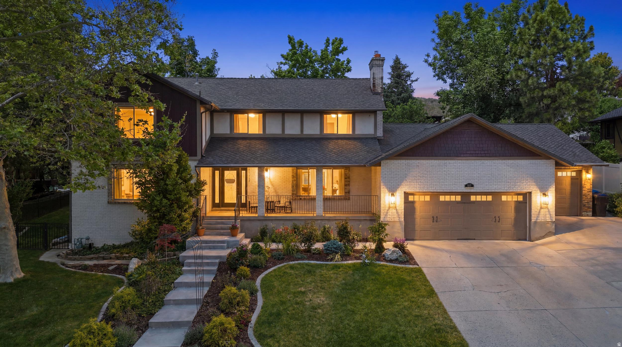 This beautiful two-story home is tucked away in a wooded, tranquil pocket of Kaysville. It sits on a quiet street with no through traffic, and a stream you can actually hear in the summertime. It's the kind of place that makes you exhale the moment you pull in.  A large covered front porch welcomes you before you even step inside. The main level is light and bright with large windows, two living spaces, and a flexible room that works perfectly as a home office or den. Three sets of doors open to a massive back patio - the indoor-outdoor flow here is effortless and made for entertaining.  Upstairs has three bedrooms, two bathrooms, and a primary suite with its own private sitting area and French doors that open onto a large deck overlooking the backyard.  The basement has its own private entrance and is a complete living space - two bedrooms, a bathroom, a private suite, a family room, kitchenette, second laundry room, and a large cold storage. Add a stove and the rental potential is right there.  Walk outside and it gets even better. Photos won't do it justice. Fully fenced and terraced with a heated pool, in-ground trampoline, fireplace, waterfall, fish pond, fruit trees, an herb garden, and landscaping someone clearly poured their heart into for years.  Recent updates: 2024 water heater, 2024 whole-home water filtration, 2025 reverse osmosis, new pool pump, completed fencing, finished drywalled and painted garage, fresh paint upstairs, new banister, and a roof that's only 78 years old.  Close to schools, restaurants, and shopping - but pull onto Hods Hollow Drive and it feels like the rest of the world disappears. This one has to be seen in person.   Square footage figures are provided as a courtesy estimate only. Buyer is advised to obtain an independent measurement.