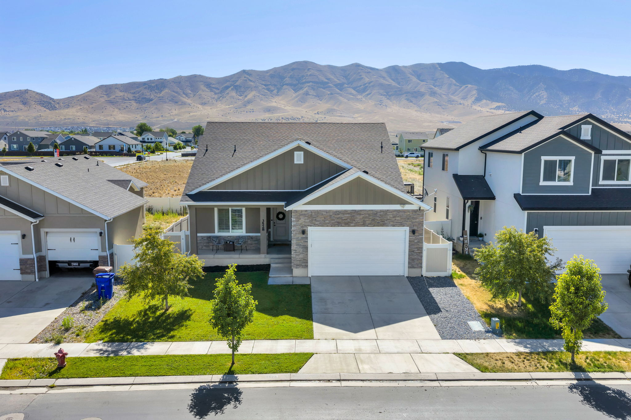 Beautifully finished and move-in ready, this 4,000+ sq ft home offers incredible value in one of Eagle Mountain's most desirable neighborhoods. Enjoy the rare convenience of a main-floor primary suite, dedicated office, and two full bathrooms. The spacious open kitchen, dining, and living area is perfect for entertaining with granite countertops, soft-close two-tone cabinetry, plantation shutters, and 9' ceilings. The west-facing backyard offers evening shade, a deck, patio, new sod, and no neighbors directly behind for added privacy. The basement is already framed with electrical completed, making it easy to finish and build instant equity with space for additional bedrooms, bathrooms, a large family room, or even a second kitchen. Enjoy nearby parks, trails, schools, shopping, and exceptional HOA amenities including a clubhouse, fitness center, arcade, and playground. Square footage figures are provided as a courtesy estimate only and were obtained from county records. Buyer is advised to obtain an independent measurement.