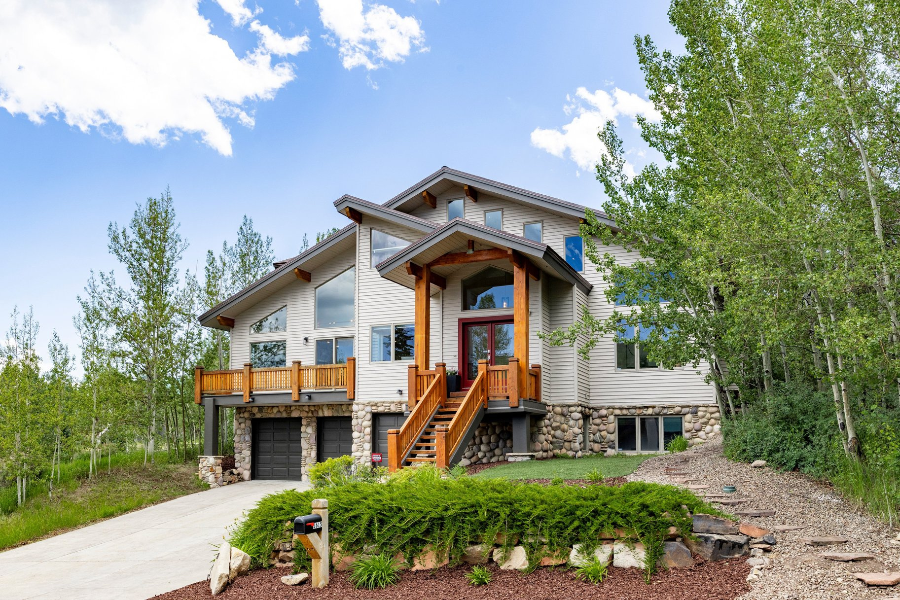 Perched on a open lot bordering open space, this home enjoys a fantastic setting in Aspen Springs Ranch, one of Park City's most desirable "in-town" neighborhoods. Tucked behind the iconic white barn and McPolin Farm open space, 2615 Aspen Springs offers a coveted balance of privacy and proximity, within minutes of Main Street, the ski resorts, and commercial centers, and offers an unparalleled combination of mountain living, modern luxury and convenient access to Park City's world-class skiing, dining and year-round trails for hiking and mountain biking.  Inside, natural light and mountain views fill the home, with south-facing views of the ski resorts and a perfectly framed view of "PC" hill from the primary suite. The layout is ideal for entertaining, with three gathering areas and plenty of outdoor space. Other features include a fenced backyard, three decks, theater room, mud room, hot tub, and three-car garage.  For its spacious layout, prime location in Aspen Springs, and ski resort views, this home is priced as an outstanding opportunity for the Park City marketplace.