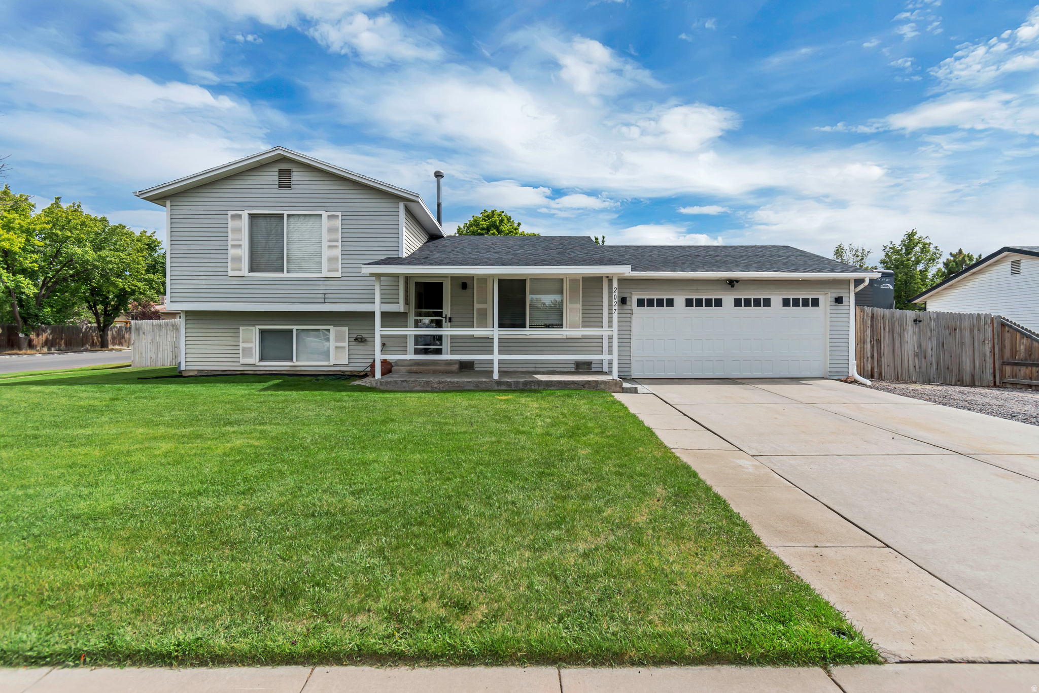 Welcome home to this well-maintained Riverton property situated on a spacious 0.28-acre corner lot in the established Brookwood Estates neighborhood. Offering 3 bedrooms, 2 bathrooms, and 1,284 square feet of living space, this home provides a functional multi-level floor plan with room to spread out.  The fully fenced yard is ideal for pets, play, gardening, or entertaining, while the covered patio creates the perfect space to enjoy summer evenings and backyard gatherings. Need extra storage or workspace? You'll love the detached outbuilding, oversized garage with workbench, and abundant RV parking.  Beyond the spacious yard and parking, you'll appreciate the home's practical and comfortable layout. The finished lower level expands the living space and offers flexibility for a family room, game room, home office, or guest retreat. Combined with a brand-new roof, this home offers the kind of value and peace of mind that's increasingly hard to find.  Conveniently located near schools, parks, shopping, and commuter routes, this property offers the perfect combination of space, functionality, and value. If you've been searching for a home with room for your vehicles, toys, hobbies, and outdoor living, this Riverton gem is a must-see.  Square footage figures are provided as a courtesy estimate only and were obtained from county records.  Buyer is advised to obtain an independent measurement.